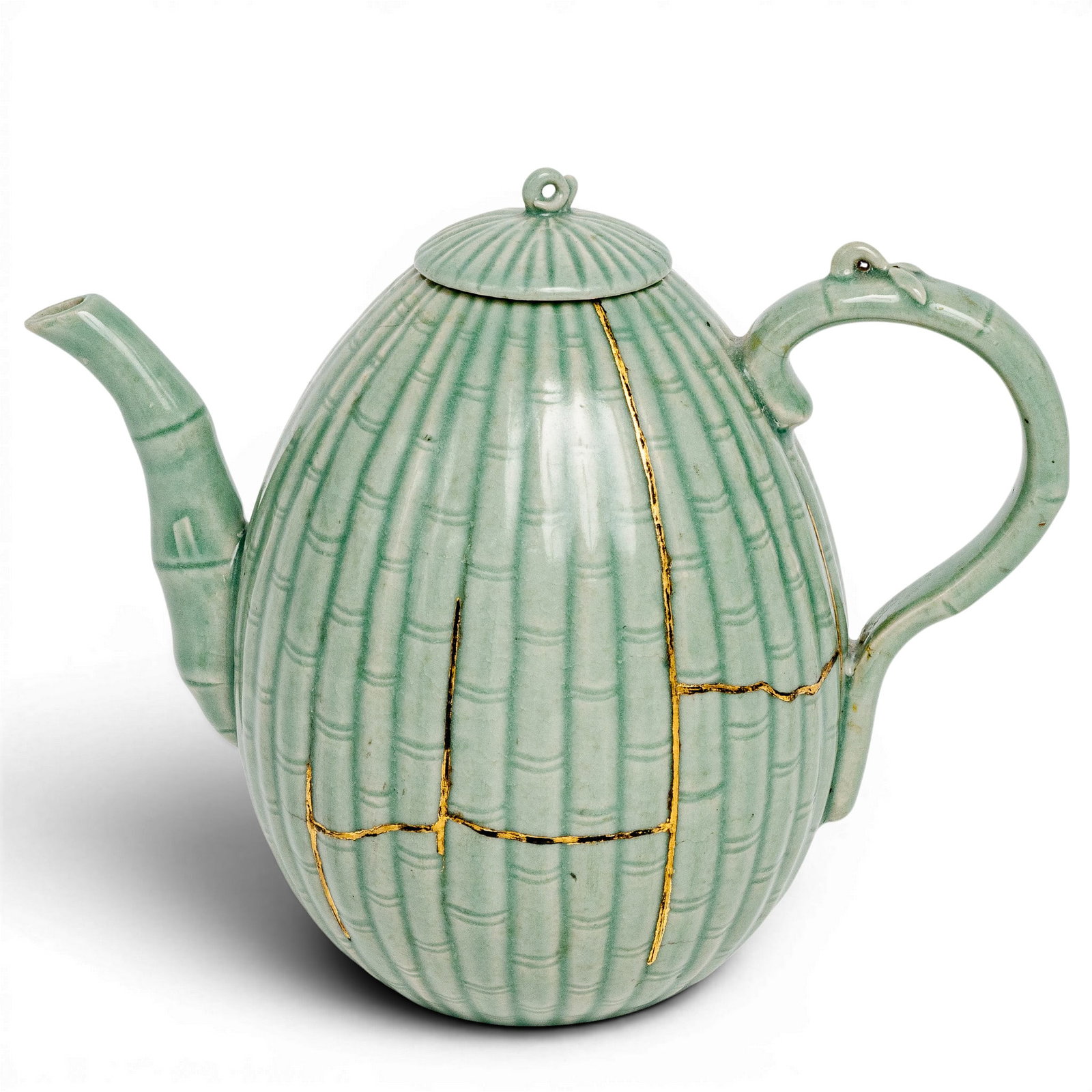Korean Celadon Melon Shaped Ewer, Bamboo Stalk Design: Korean Celadon Melon Shaped Ewer, Bamboo Stalk Design Likely Goryeo dynasty, Korean Finely molded ewer shape with bamboo style handle and spout. The body features a bamboo stalk design. There are