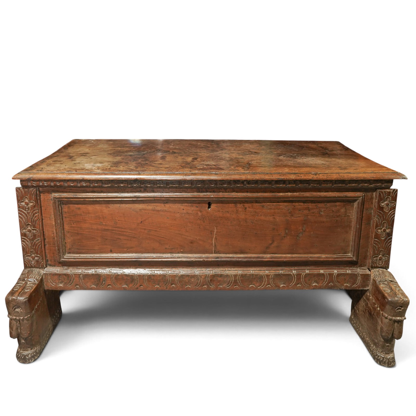 Antique Walnut Cassapanca Carved Wood Cassone: Antique Walnut Cassapanca Carved Wood Cassone Late 17th Century, Sardinia A substantial rectangular walnut chest with a plain front frieze, sides carved with daisy motifs, and a lower band decorated g