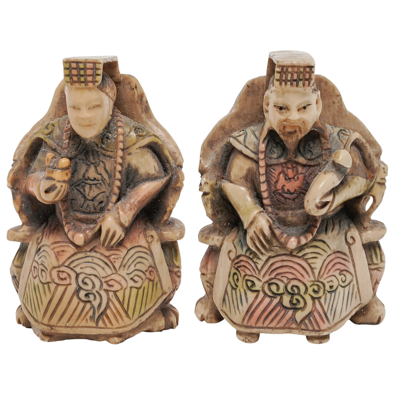 (2 pc) Japanese Carved Bone Okimono: (2 pc) Japanese Carved Bone Okimono 20th century , Japanese These intricately carved, polychrome-painted bone okimono figures depict traditional East Asian sages or immortals seated on ornate thrones.