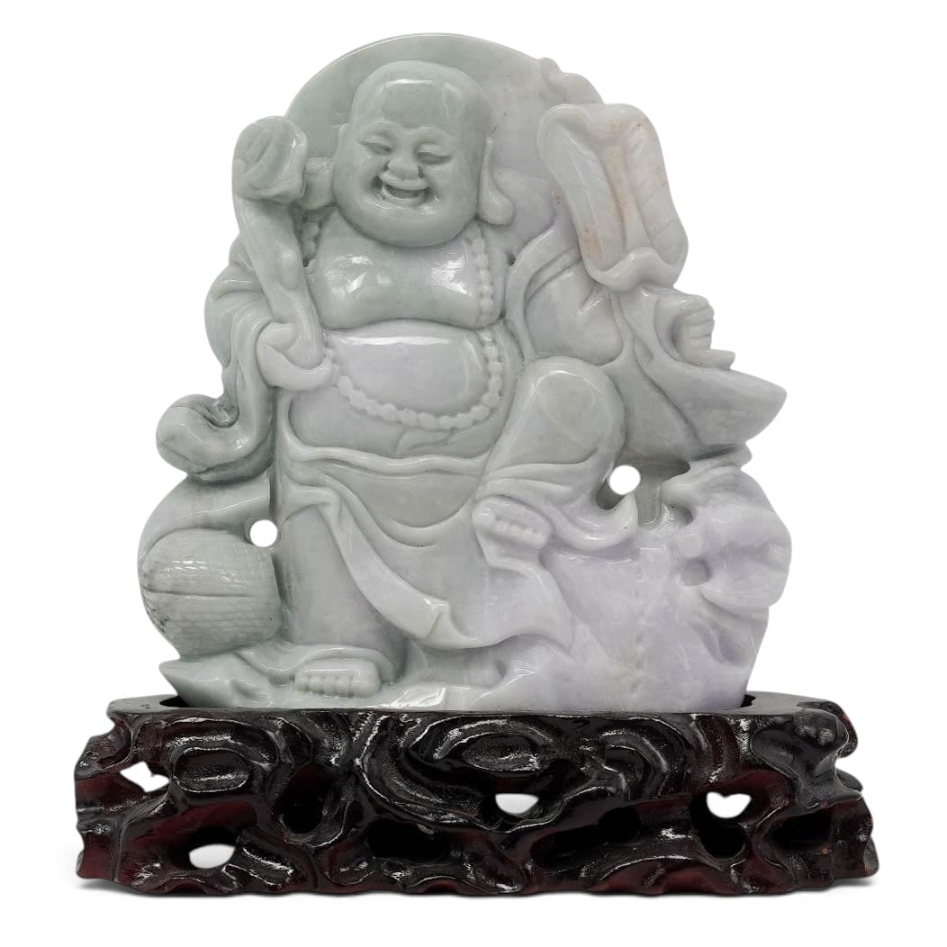 Chinese Carved Jadeite Laughing Buddha With Wooden Stand: Chinese Carved Jadeite Laughing Buddha With Wooden Stand 20th Cent., Chinese The piece features a distinct two-tone lavender and pale green coloration with a polished finish. It stands securely mounte
