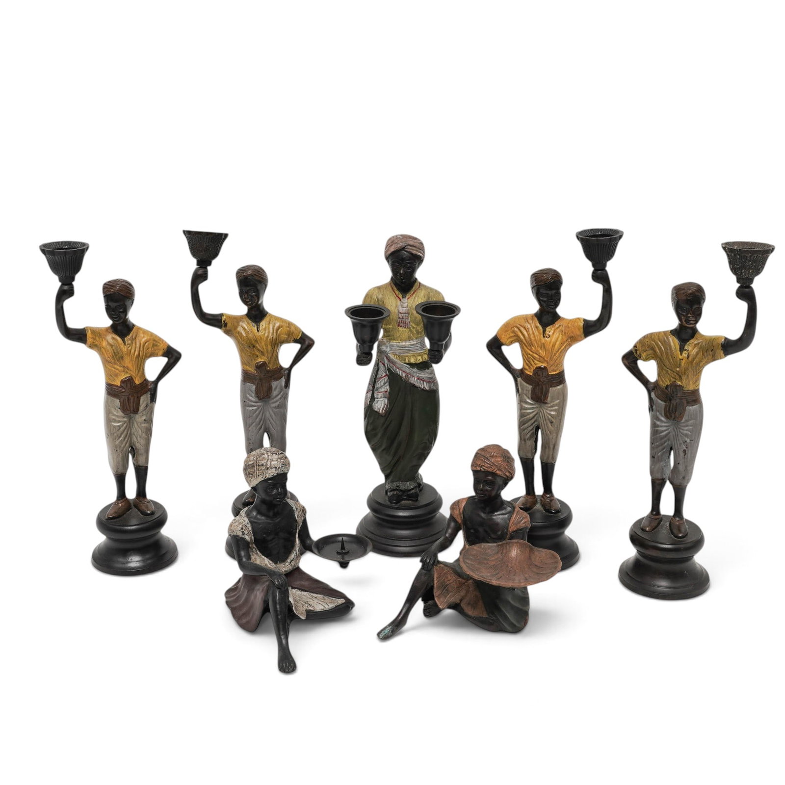 (7pc) Vintage Blackamoor Cold-Painted Metal Candlestick Holders: (7pc) Vintage Blackamoor Cold-Painted Metal Candlestick Holders Mid 20th Cent. Vintage Hollywood Regency-style figural candlestick holders crafted from heavy cast metal with hand-painted polychrome