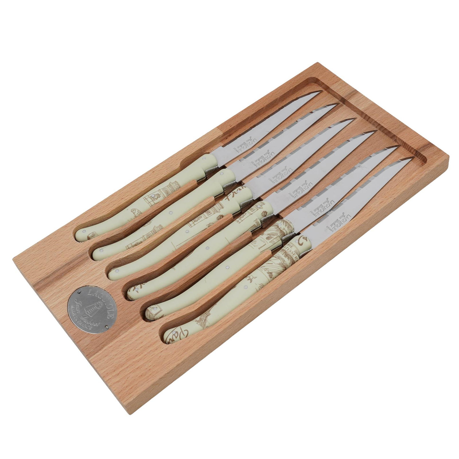 (6 pc) Jean Dubost Laguiole Steak Knife Set: (6 pc) Jean Dubost Laguiole Steak Knife Set France, 20th Cent A six-piece set of Jean Dubost Laguiole steak knives with cream, vintage-printed handles. The set comes organized in a light wood presenta