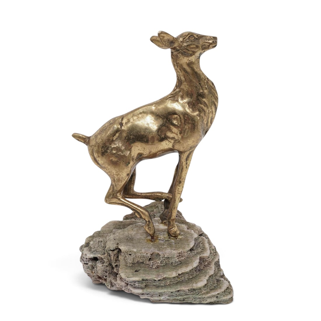 Vintage Solid Brass Deer Figurine: Vintage Solid Brass Deer Figurine MCM, India This vintage brass deer figurine features a textured, rocky base and a stylized golden finish. It is categorized as Mid-Century Modern decor. H. 8.5" x 5" 