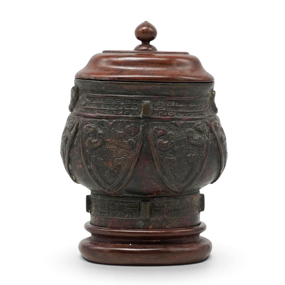 Chinese Qing Archaistic Bronze & Wood Lidded Vessel: Chinese Qing Archaistic Bronze & Wood Lidded Vessel Late 19th to early 20th Cent. Chinese Cast from heavy bronze with a dark, aged patina and decorated in high relief with traditional archaistic