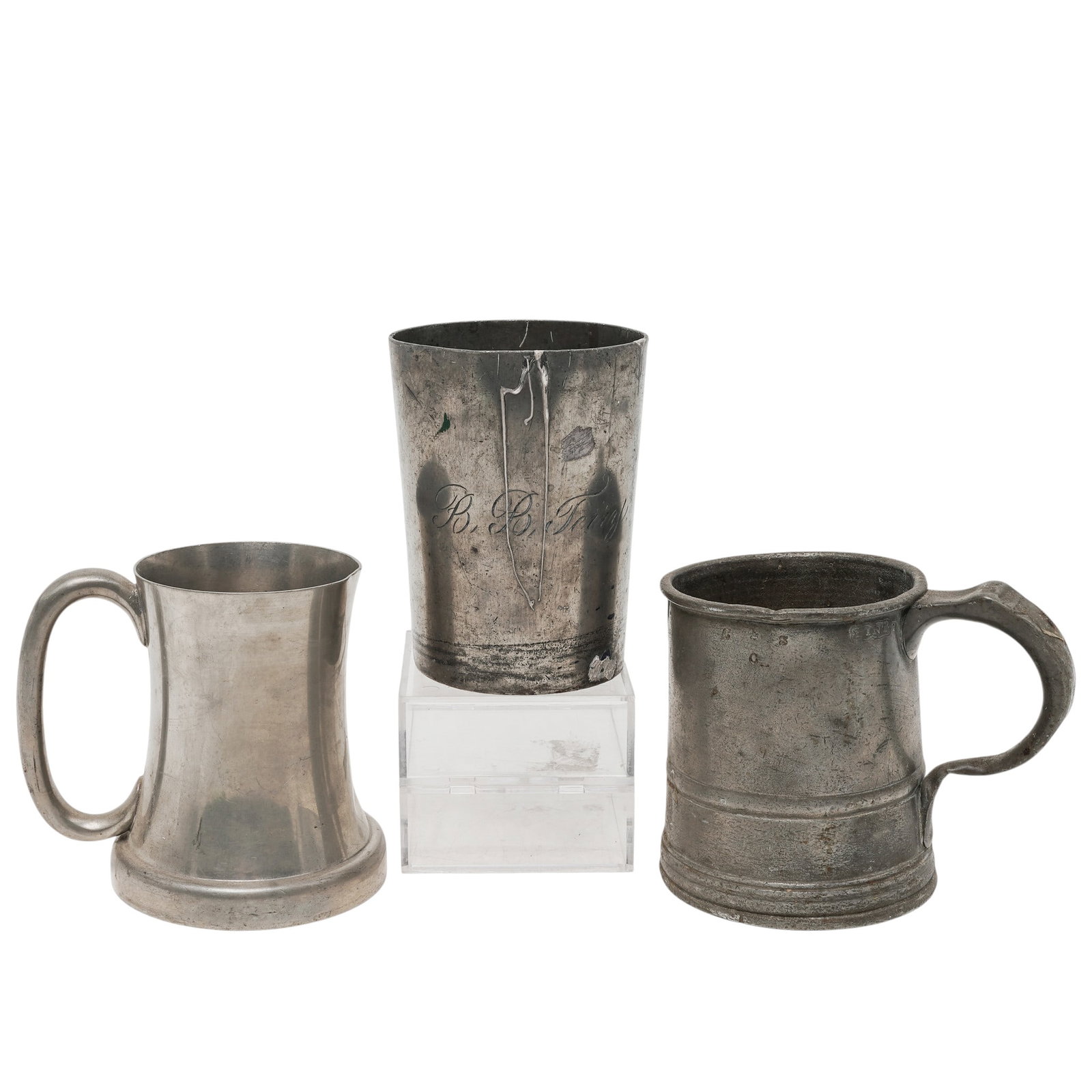 (3 pc) Antique English Pewter Drinking Vessels: (3 pc) Antique English Pewter Drinking Vessels Late 19th Century, England A three-piece grouping of antique English pewter drinking vessels, comprising two handled tankards and one tall cylindrical