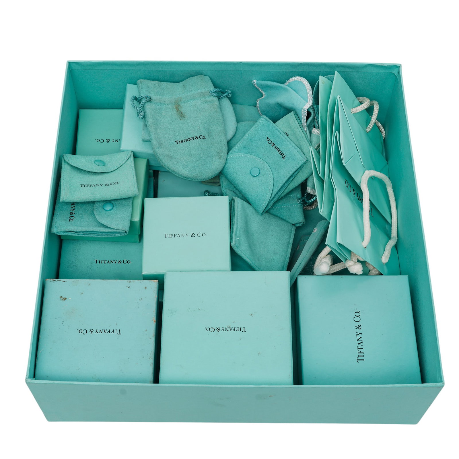 (30 pc) Tiffany & co. Packaging Materials Boxes Bags & Pouches: (30 pc) Tiffany & co. Packaging Materials Boxes Bags & Pouches 20th century, USA 30 pieces lot of Tiffany & co. luxury packaging materials: boxes, bags, fabric and suede jewelry pouches gathered