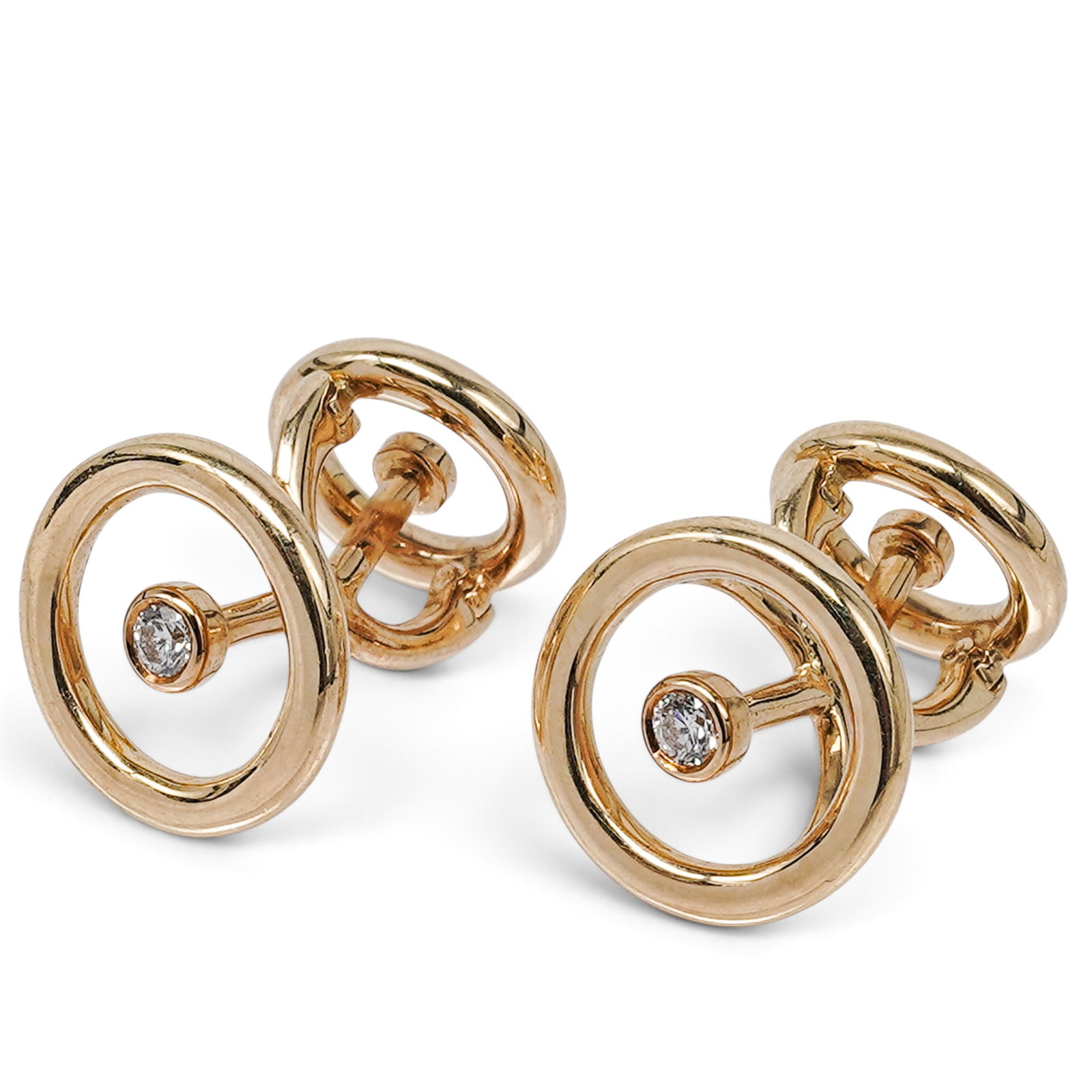 Boucheron 18K Gold & Diamond Cufflinks: Boucheron 18K Gold & Diamond Cufflinks Contemporary, French Pair of Boucheron 18K yellow gold cufflinks designed with circular polished gold terminals and bezel-set round brilliant-cut diamond accents