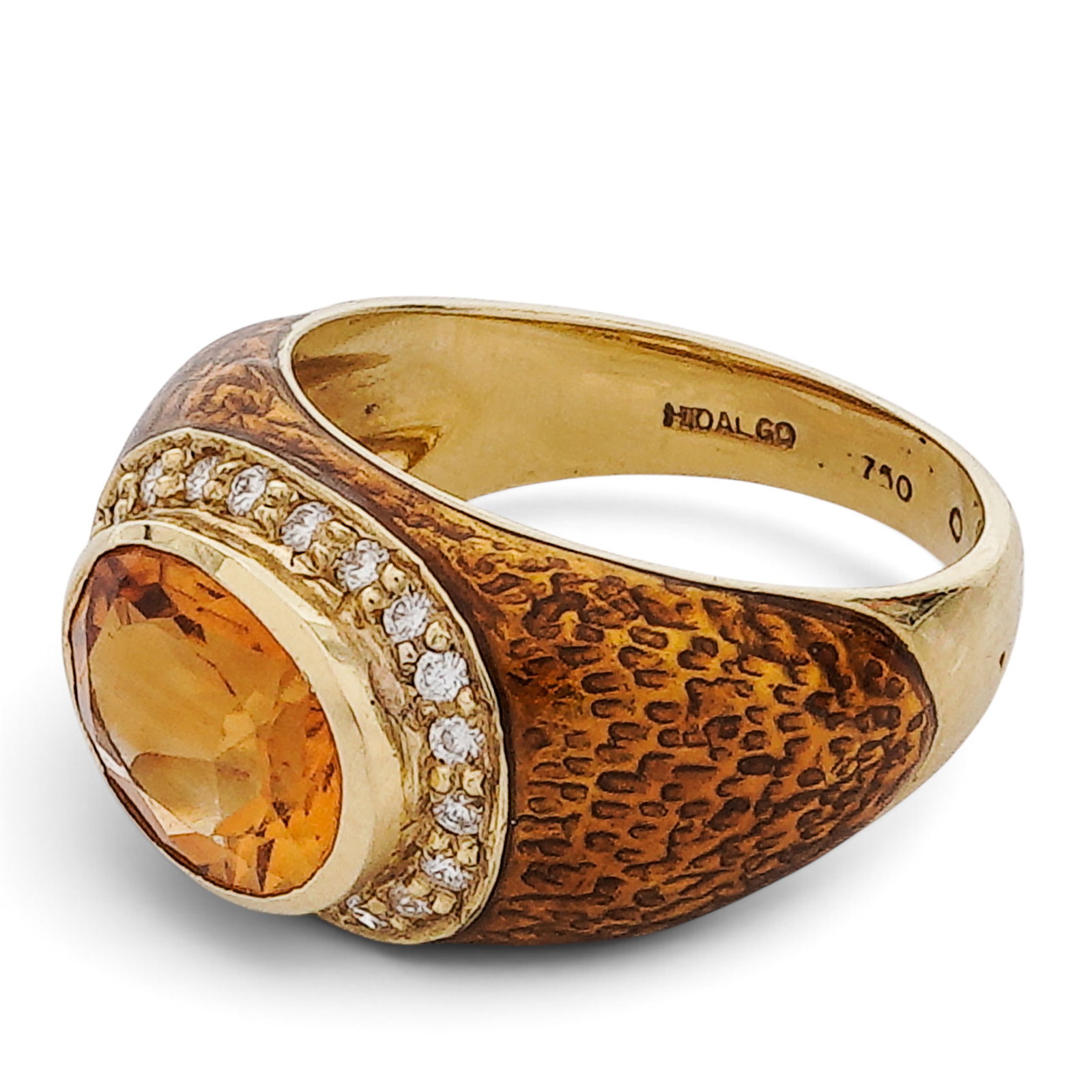 Hidalgo 18K Gold Citrine & Diamond Ring: Hidalgo 18K Gold Citrine & Diamond Ring 2000s, USA Hidalgo 18K yellow gold ring set with an approx. 4.00 ct oval faceted citrine center and approx. 0.20 ctw diamond accents in a wide pavé-set setting
