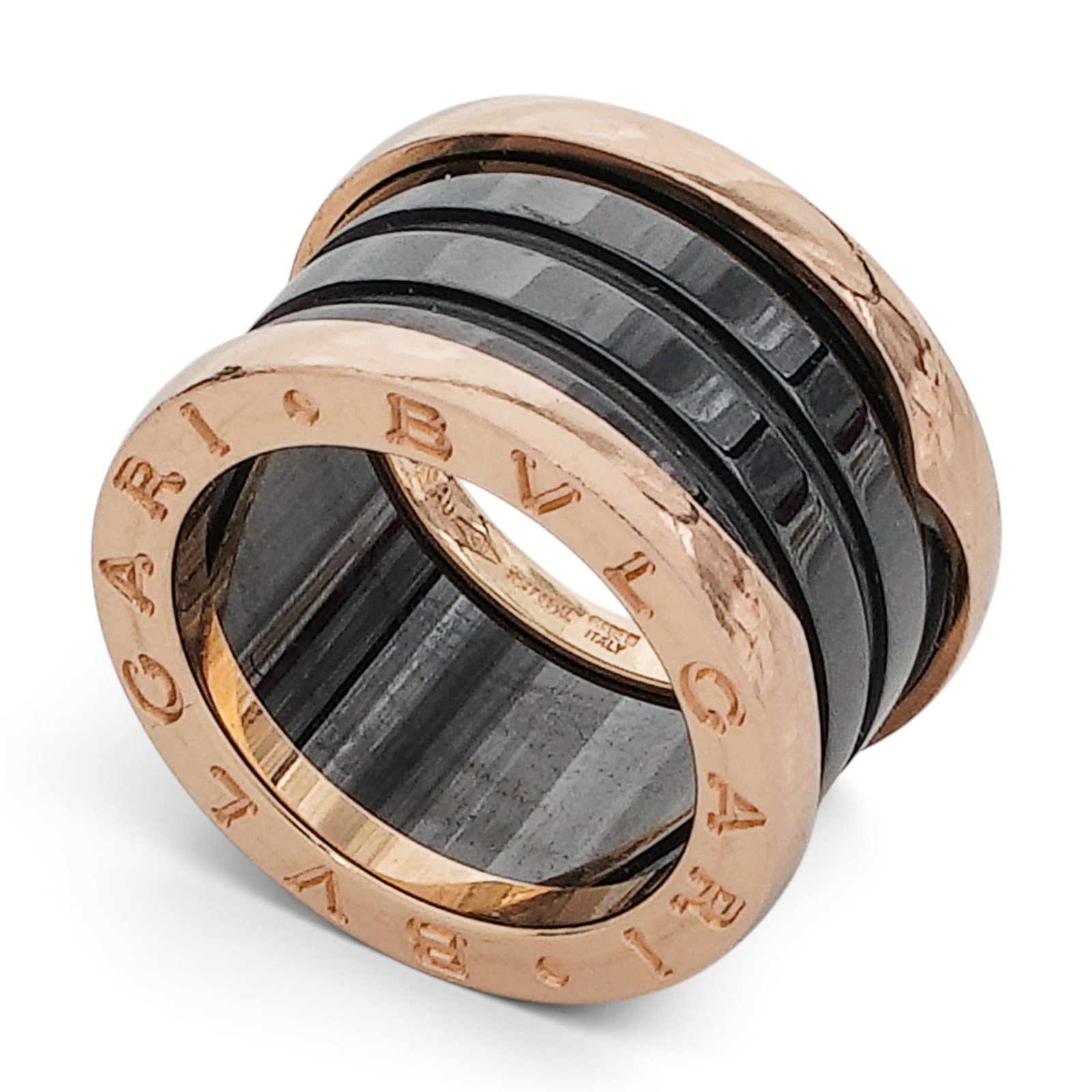 Bvlgari "B.zero1" Black Ceramic 18K Gold Ring: Bvlgari "B.zero1" Black Ceramic 18K Gold Ring Contemporary, Italian Bvlgari B.zero1 ring in 18K rose gold and black ceramic with engraved Bvlgari logo edges, grooved black ceramic center band, and pol