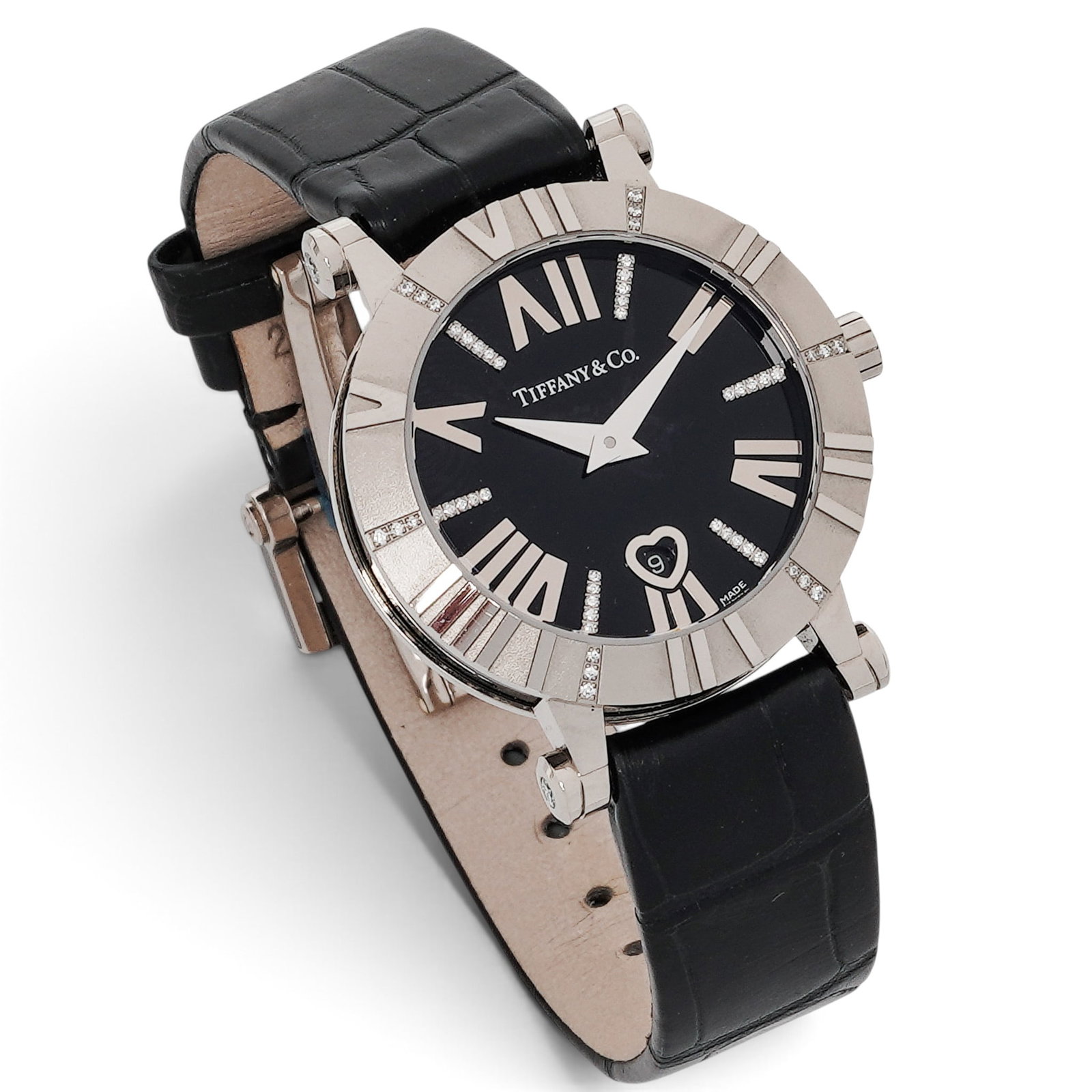 Tiffany & Co. "Atlas" 18K Gold & Diamond Watch REF 2051A: Tiffany & Co. "Atlas" 18K Gold & Diamond Watch REF 2051A 2000s-2010s, Swiss Tiffany & Co. Atlas 18K white gold quartz watch with round case, black dial, applied Roman numeral markers, diamond-set hour