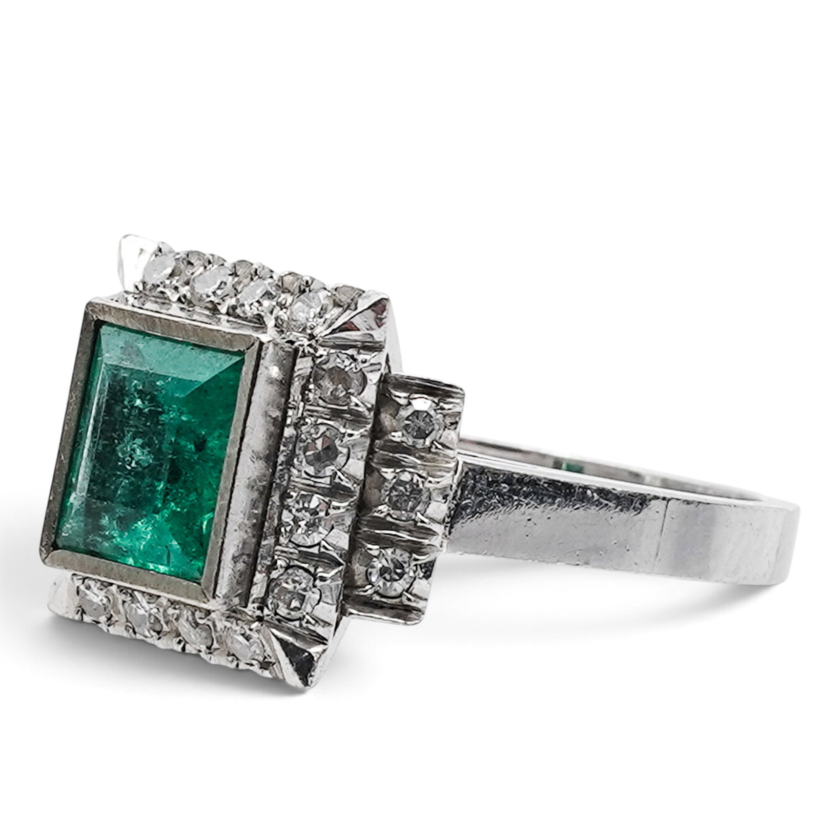 14k Gold Emerald & Diamond Cocktail Ring: 14k Gold Emerald & Diamond Cocktail Ring Mid-Late 20th Century 14K gold cocktail ring centering a rectangular emerald framed by round diamond accents in a raised geometric cocktail setting. Stones: Ap