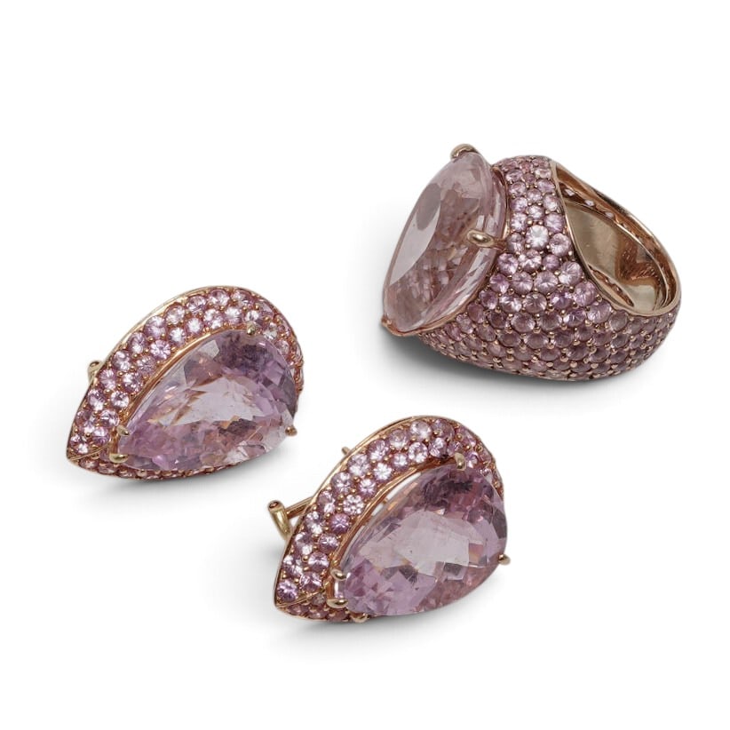 Adler 18K Gold Kunzite & Pink Sapphire Ring and Earring Set: Adler 18K Gold Kunzite & Pink Sapphire Ring and Earring Set Late 20th to Early 21st Century, Swiss Adler 18K gold cocktail ring and matching earrings, with a large pear-shaped faceted kunzite center s