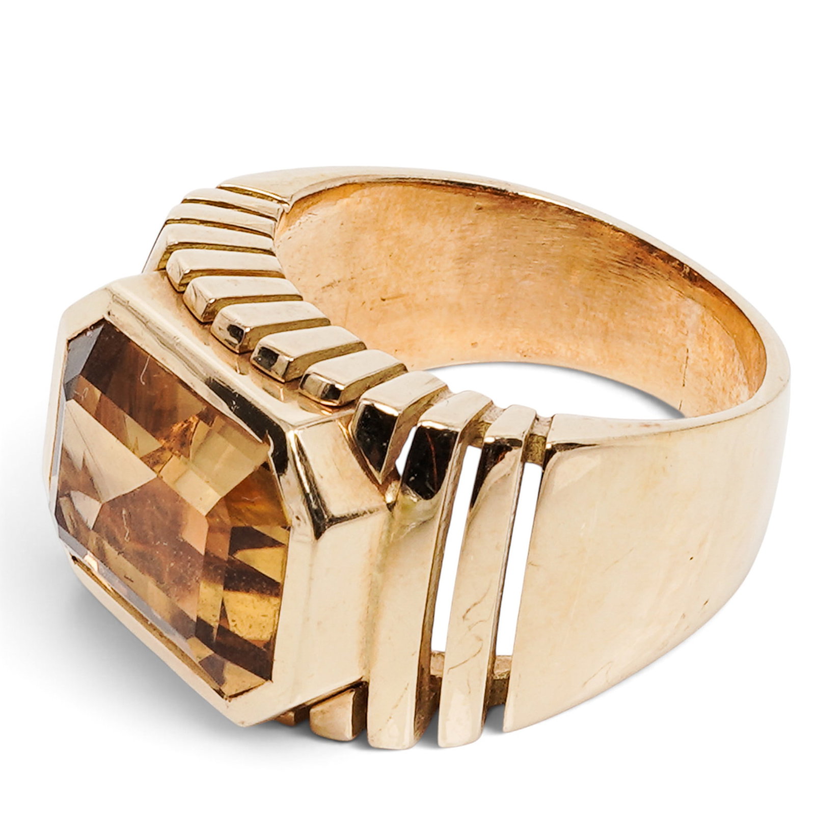 French 18K Gold Citrine Cocktail Ring: French 18K Gold Citrine Cocktail Ring Late 20th Century, French 18K yellow gold cocktail ring with a large rectangular faceted citrine center in a bezel setting and ribbed architectural shoulders. Sto