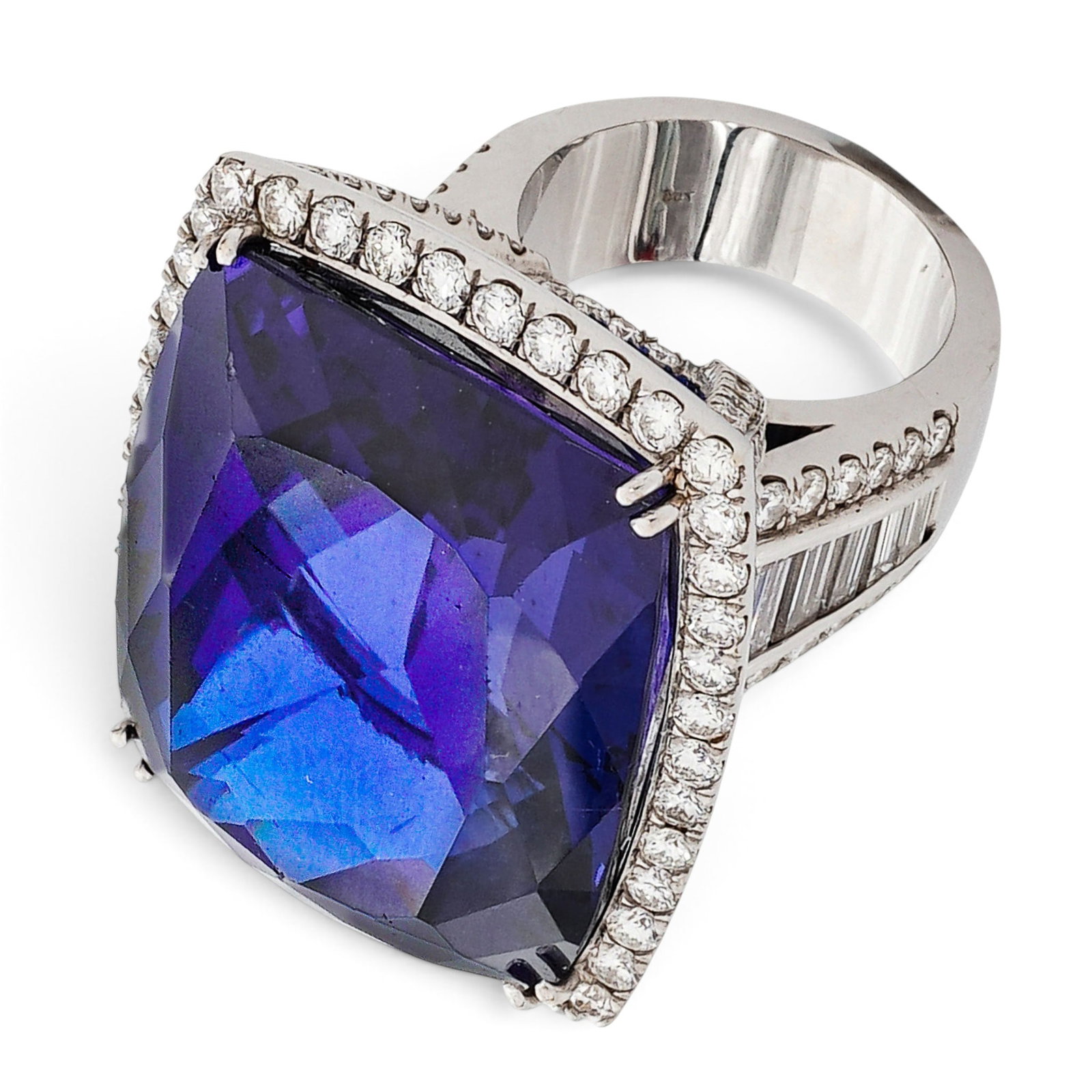 18K Gold 125ct Tanzanite & Diamond Cocktail Ring: 18K Gold 125ct Tanzanite & Diamond Cocktail Ring Contemporary Large 18K white gold cocktail ring with a massive cushion-cut tanzanite framed by a round diamond halo and additional round diamond accent