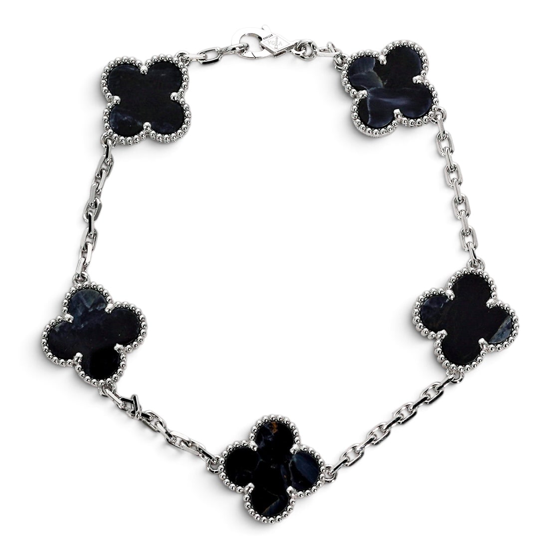 Rare Van Cleef & Arpels Gold Pietersite "Vintage Alhambra" Bracelet: Rare Van Cleef & Arpels Gold Pietersite "Vintage Alhambra" Bracelet Contemporary, French Van Cleef & Arpels 18K white gold Vintage Alhambra 5 motif bracelet with blue pietersite quatrefoil motifs fram