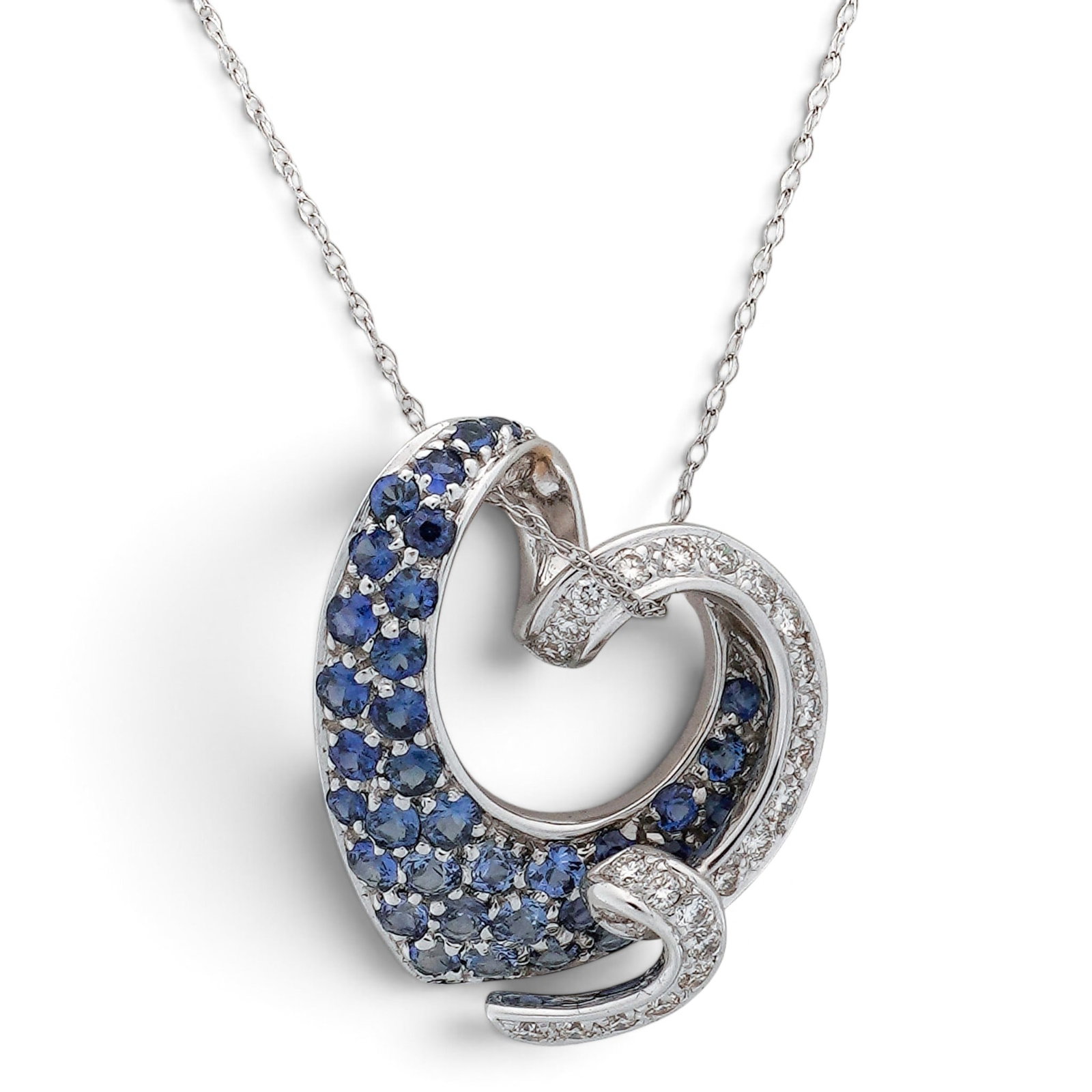 18k Gold Sapphire & Diamond Heart Pendant with 14k Necklace: 18k Gold Sapphire & Diamond Heart Pendant with 14k Necklace Year/Origin: Late 20th Century 18K white gold open heart-form pendant set with approx. 1.10 ctw sapphires and approx. 0.4 ctw diamonds, susp