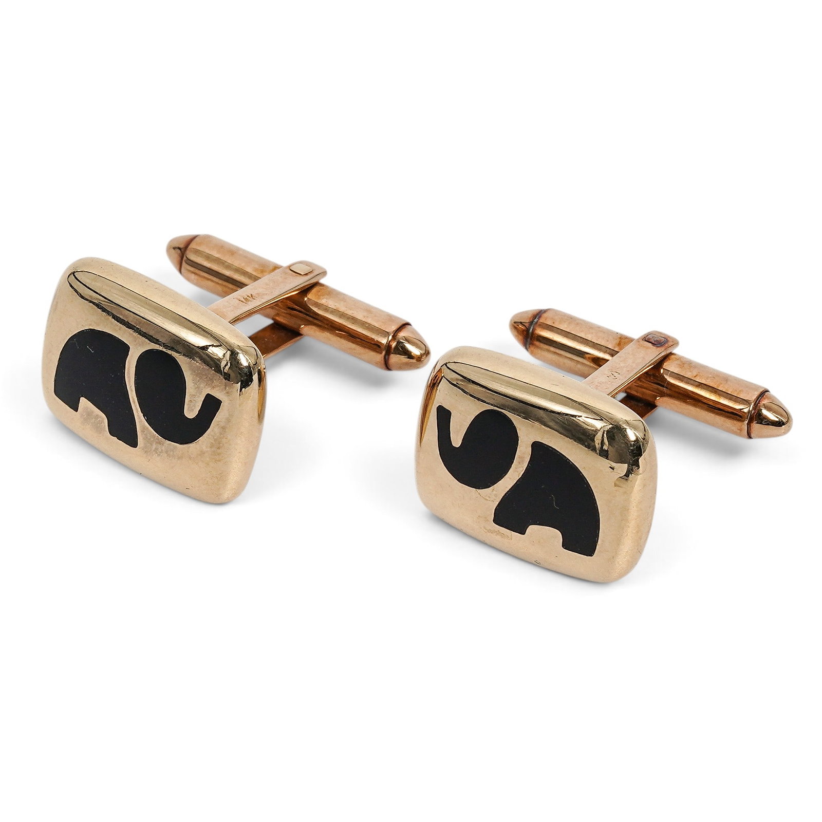 Swank 14K Gold & Onyx Elephant Cufflinks: Swank 14K Gold & Onyx Elephant Cufflinks Mid/Late 20th Century Swank 14K yellow gold rectangular cufflinks with polished finish and black onyx elephant motif, fitted with hinged swivel backs. Stones: 