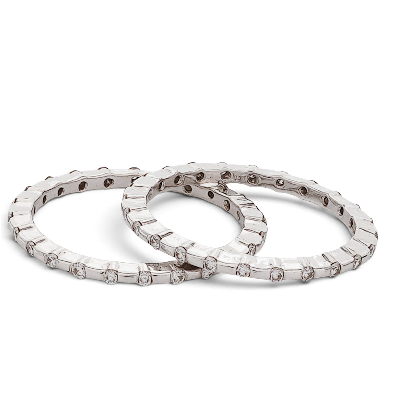 (2 Pcs) 14k Gold & Diamond Eternity Bands: (2 Pcs) 14k Gold & Diamond Eternity Bands Late 20th Century. 14K white gold diamond eternity bands set with approx. 0.30 ctw diamonds total. Tested 14k gold. Weight: 3.24 Grams. (2.08 dwt.) Size: 6.25