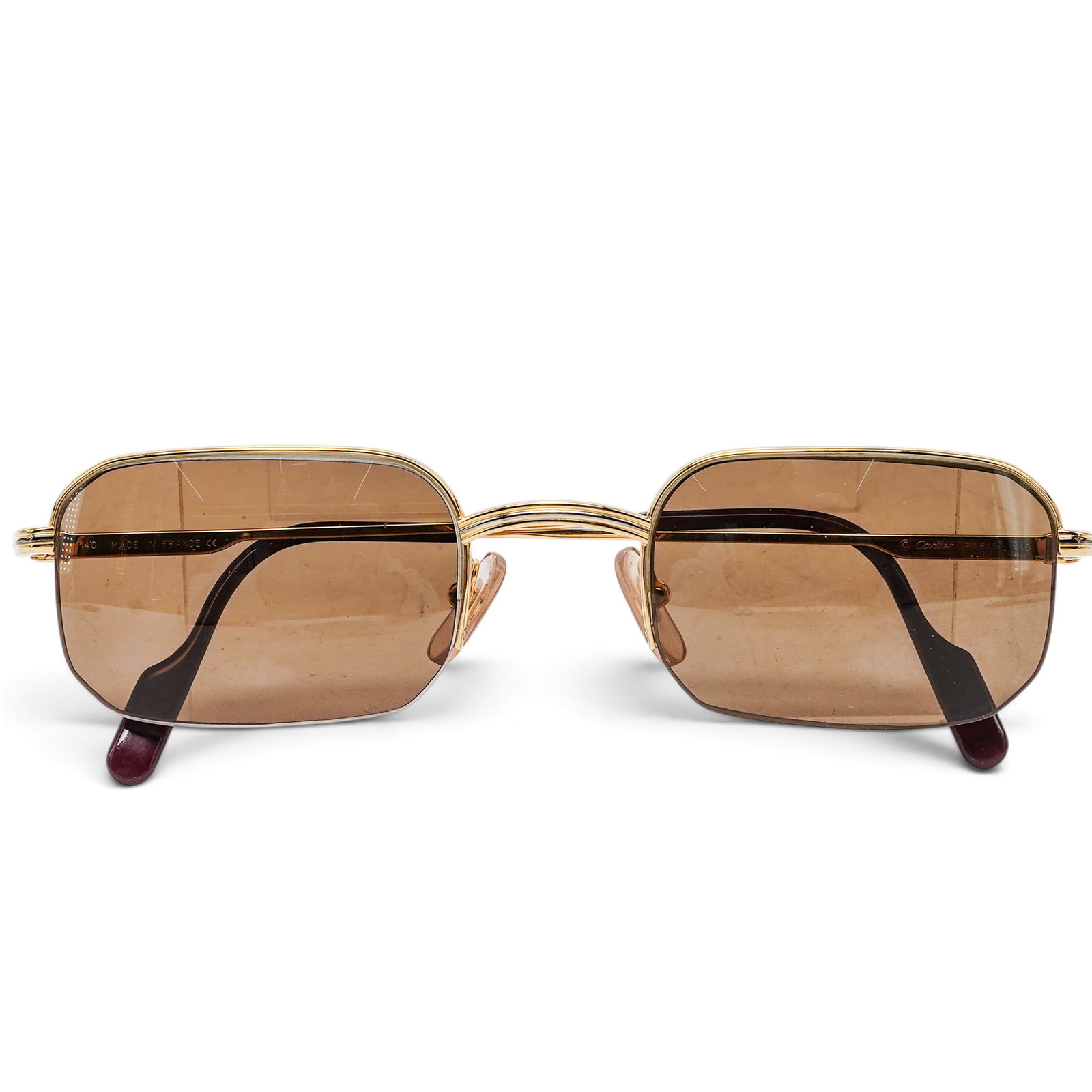 Cartier "Broadway" Gold-Plated Vintage Sunglasses: Cartier "Broadway" Gold-Plated Vintage Sunglasses 1990's, France Cartier Broadway vintage sunglasses from the 1980s–1990s with a gold-plated half-frame and brown-tinted lenses. Features signature Ca
