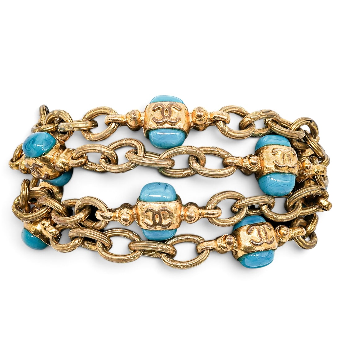 Chanel Gold & Turquoise Costume Multi-Strand Bracelet: Chanel Gold & Turquoise Costume Multi-Strand Bracelet 1990's, France Chanel Gold & Turquoise Costume Multi-Strand Bracelet featuring layered gold-tone chains and turquoise-colored CC logo accents.