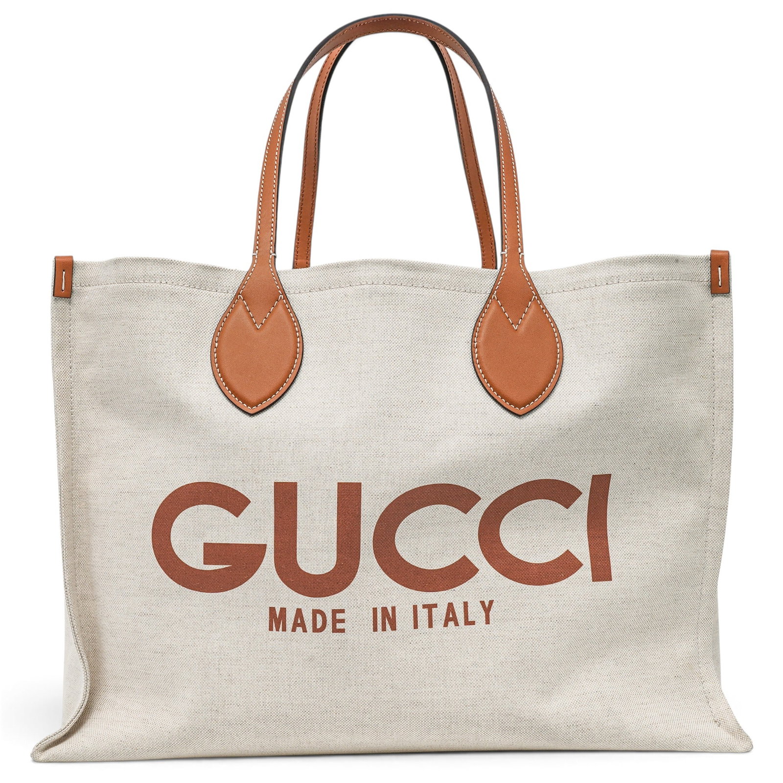 Gucci Canvas Logo Printed Reversible Tote Bag: Gucci Canvas Logo Printed Reversible Tote Bag 2025, Italy Gucci Canvas Logo Printed Tote Bag in linen canvas with brown leather trim. Features the Gucci logo across the center of the front and a monog