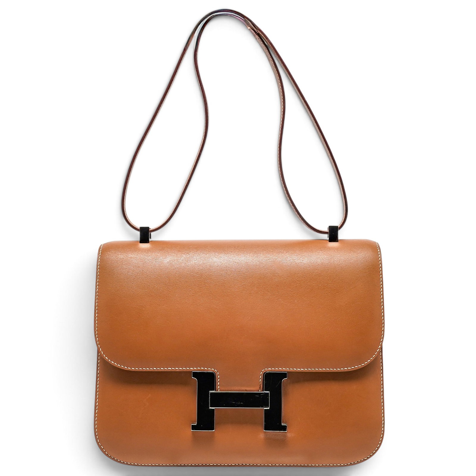 Hermes "Constance" 23cm Vache Natural Leather: Hermes "Constance" 23cm Vache Natural Leather Property of a Real Housewife of Miami, Lea Black. Hermès Constance 23cm crafted from Vache Natural leather with palladium hardware. Features the signatur