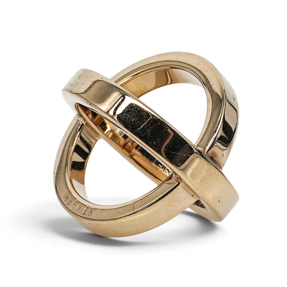 Hermes Gold-Tone "Cosmos" Scarf Ring: Hermes Gold-Tone "Cosmos" Scarf Ring 2010's, French Hermes gold-tone scarf ring in circular form with a polished center bar and openwork ring design. Markings: Signed “HERMES” and “BIJOUTERI