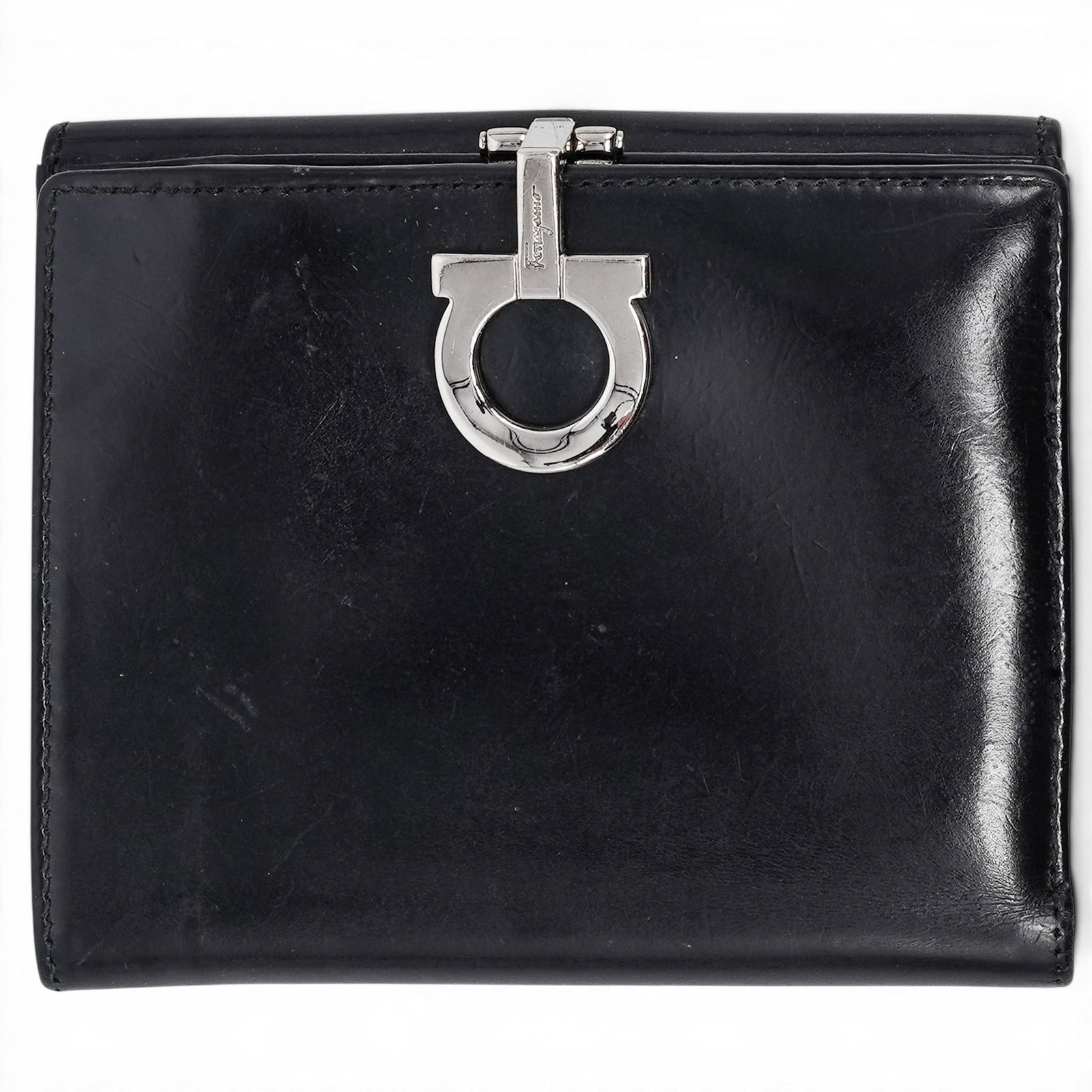 Salvatore Ferragamo Black Gancini Bit Snap Wallet: Salvatore Ferragamo Black Gancini Bit Snap Wallet 1990's, Italy Salvatore Ferragamo Black Wallet crafted from shiny box calf leather with a signature silver-tone Gancini bit snap closure and a