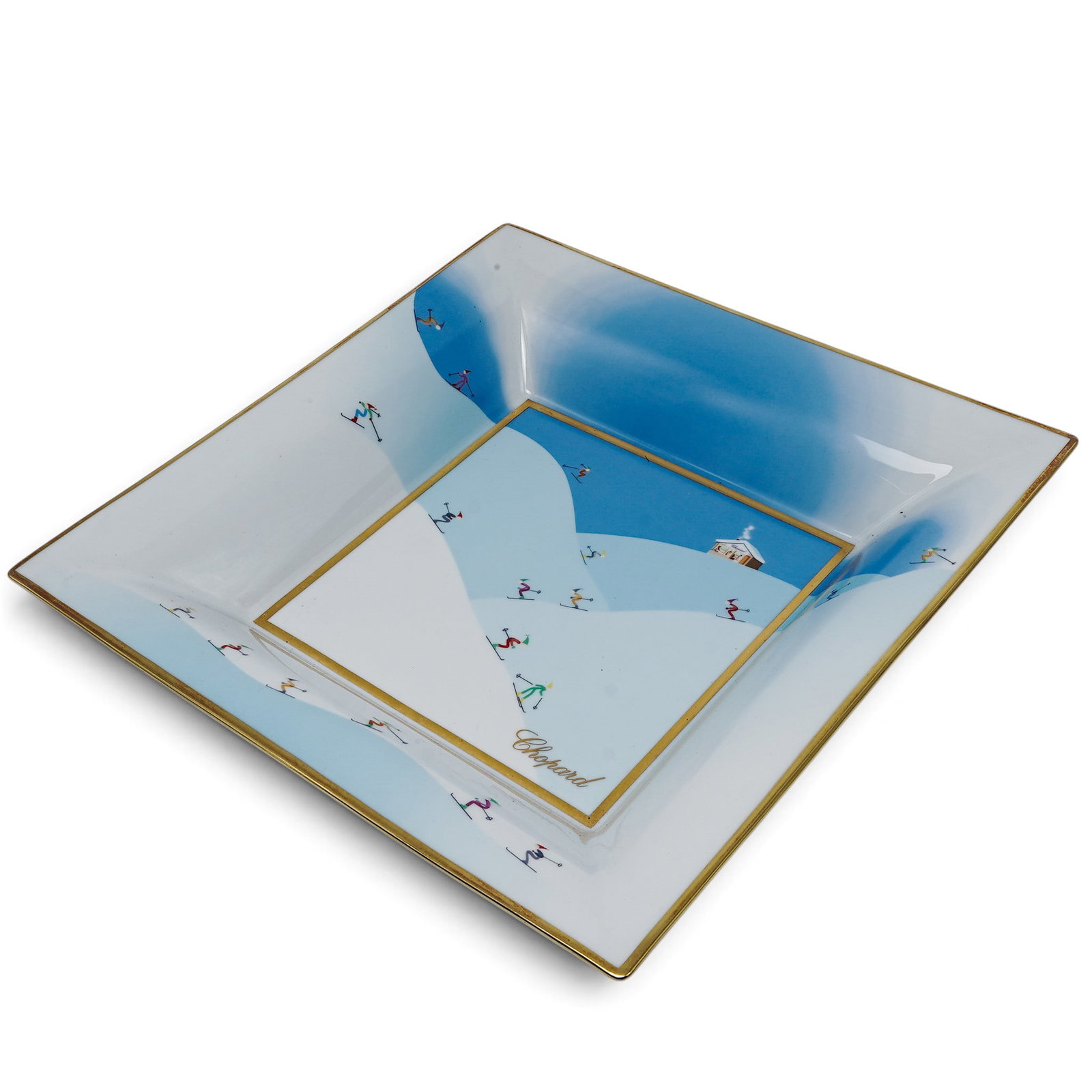 Chopard Limoges Porcelain Skier Bowl: Chopard Limoges Porcelain Skier Bowl 2010's, Swiss Chopard x Limoges Porcelain Skier Bowl featuring a decorative skier motif with gold trim. 12" L x 2" H x 12" D