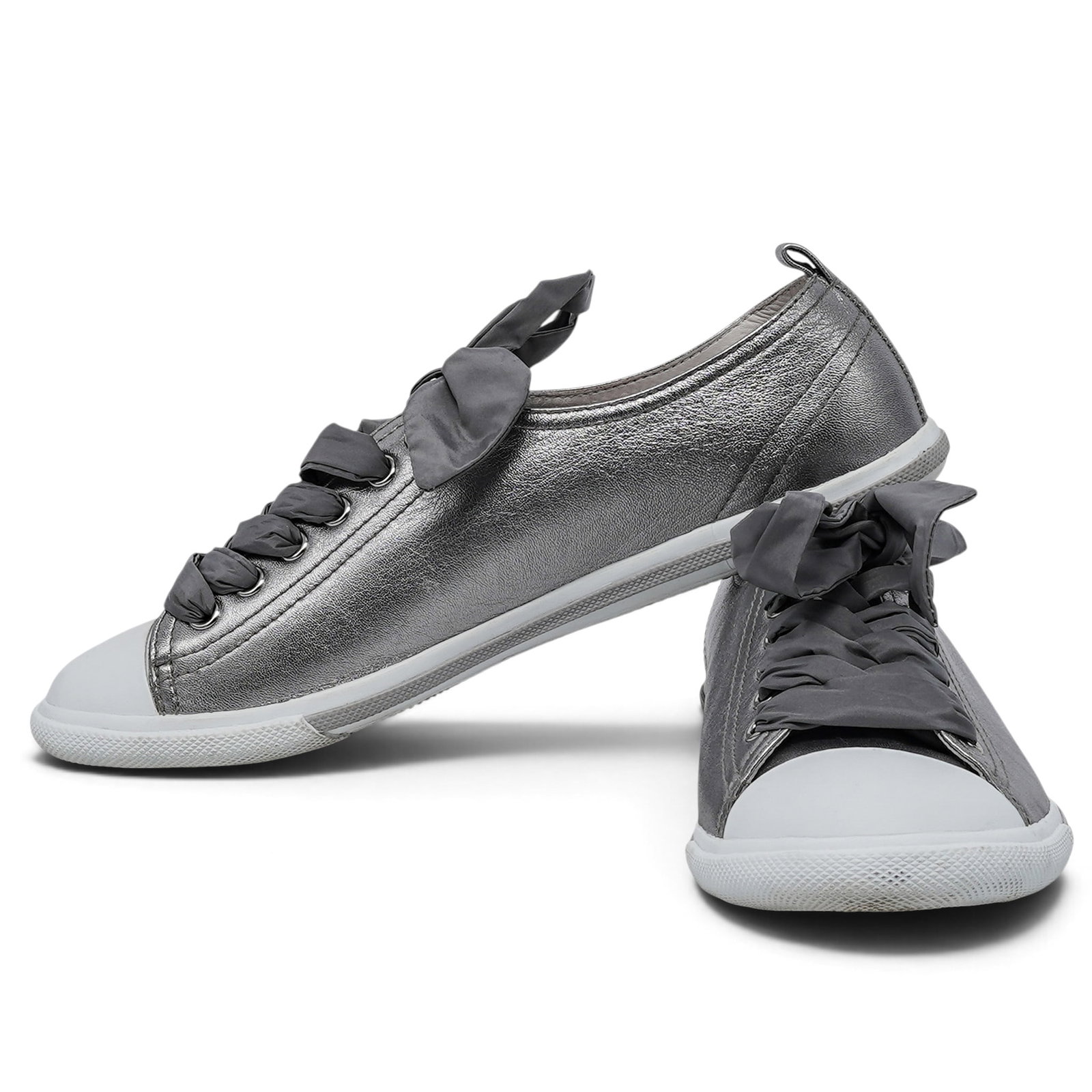 Prada Silver Leather Women's Sneakers: Prada Silver Leather Women's Sneakers 2010's, Italy Prada Women’s Sneakers crafted from silver leather, featuring thick silk laces. Includes box and dust bag. 37, (US 7)