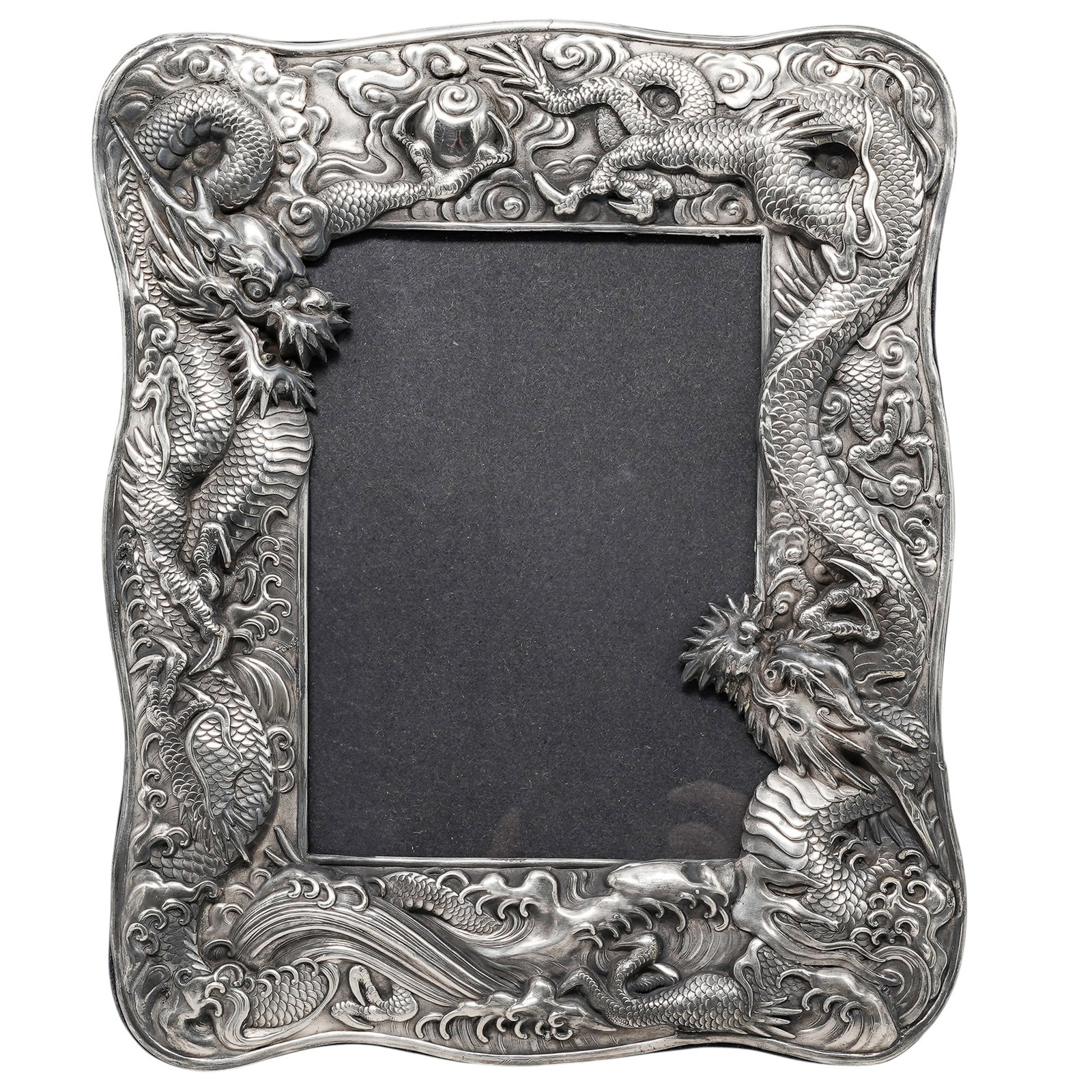 Japanese Dragon Relief Sterling Silver Frame: Japanese Dragon Relief Sterling Silver Frame Mid-Late 20th Cent. Artist/Designer/Manufacturer: Unknown Marking(s); notes: Marked “925” and “RO” below lower right corner of protective g