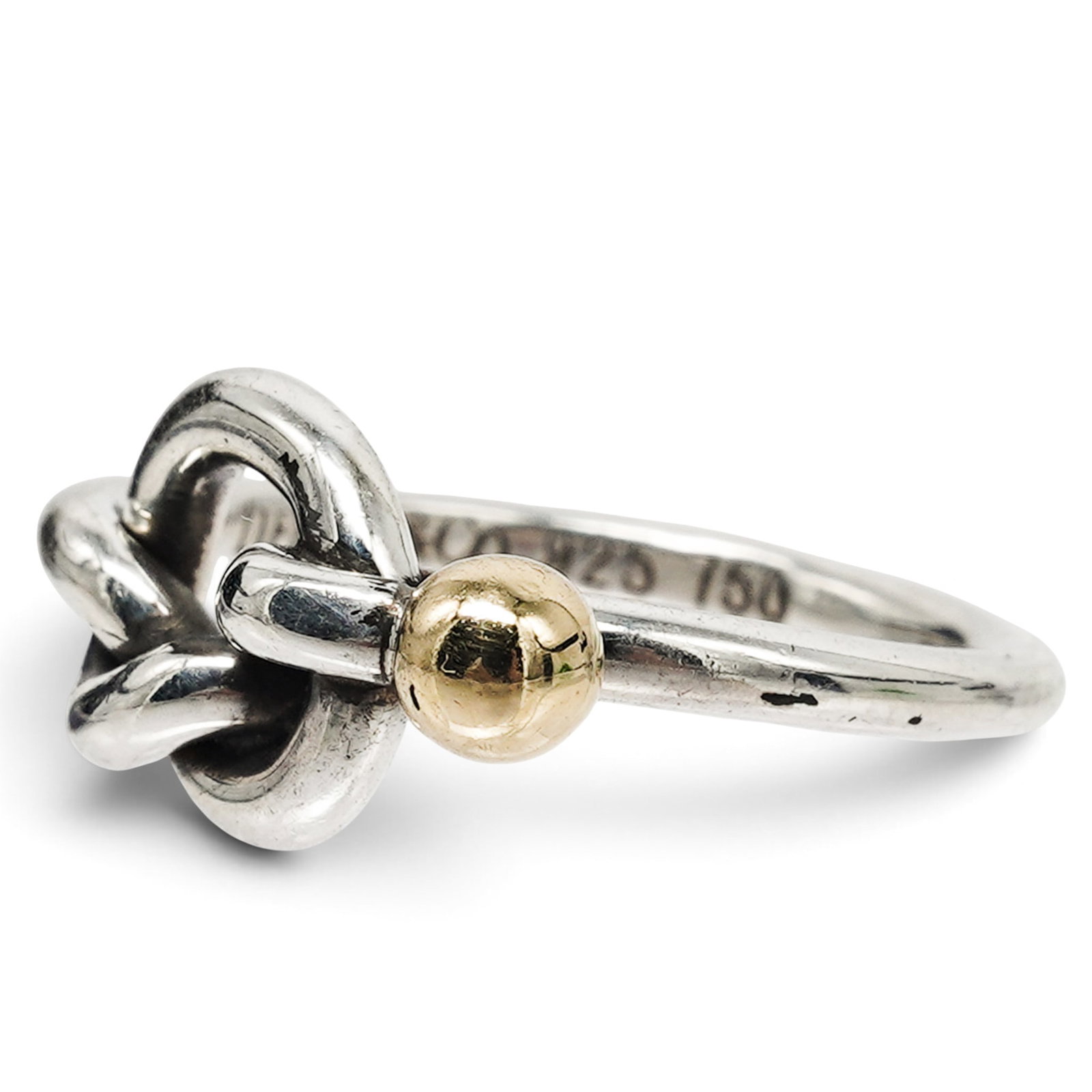 Tiffany & Co. Sterling Silver & 18K Gold Knot Ring: Tiffany & Co. Sterling Silver & 18K Gold Knot Ring 21st Century, USA Artist/Designer/Manufacturer: Tiffany & Co. Marking(s): “TIFFANY & CO.” and “925-750.” Materials: Sterling silver