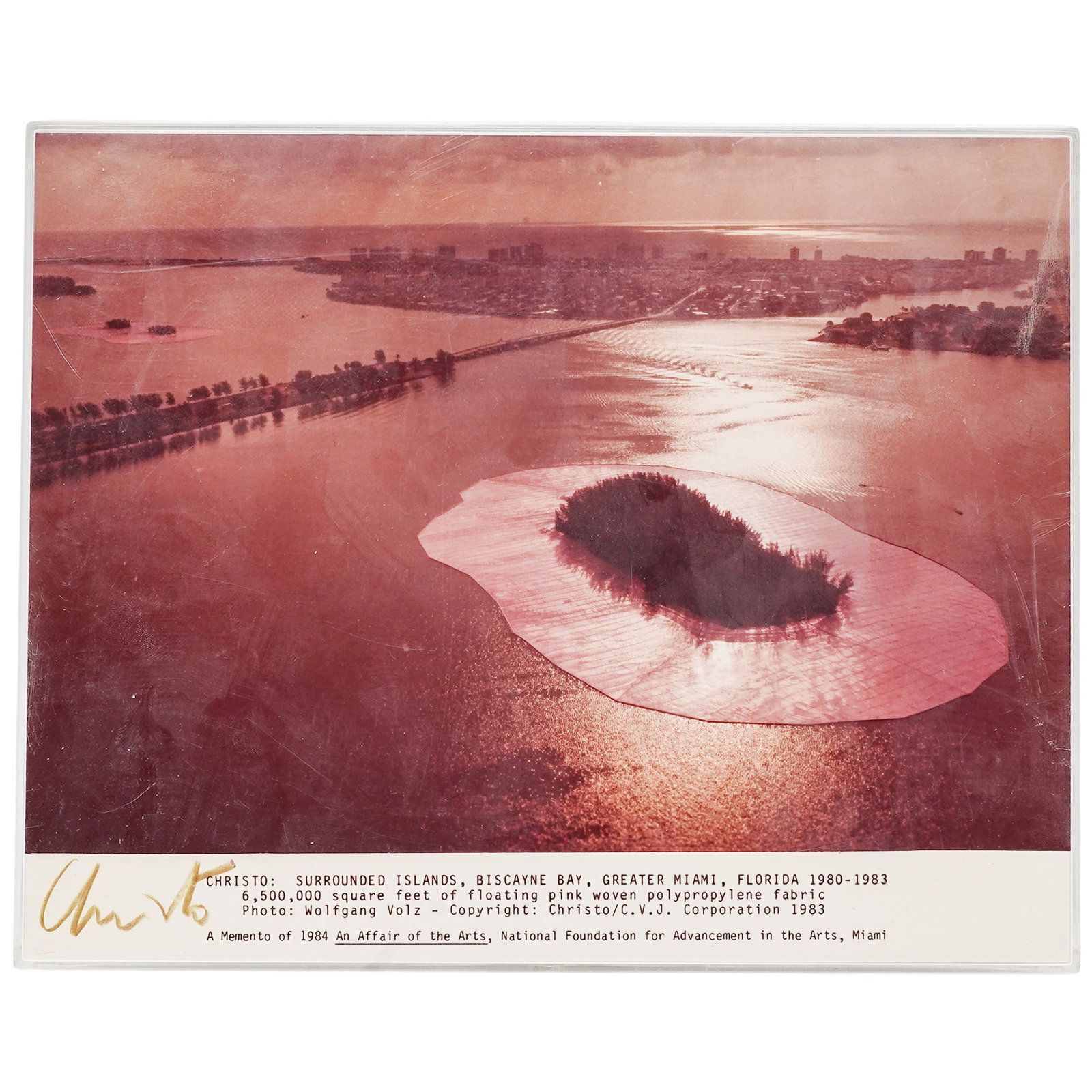 Signed Christo Biscayne Bay Photograph: Signed Christo Biscayne Bay Photograph Late 20th Century, USA Artist/Designer/Manufacturer: Christo & Jeanne-Claude. Marking(s): Signed “Christo” at lower left below image. Materials: