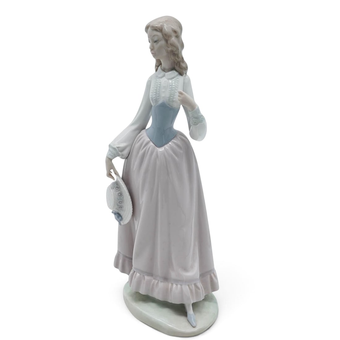 Lladro x Vincente Martinez "Eloise" Porcelain Figurine: Lladro x Vincente Martinez "Eloise" Porcelain Figurine 20th Century, Spain Artist/Designer/Manufacturer: Lladró. Marking(s): Lladró stamp to underside; No. 01005005. Materials: Porcelain & glaze. Ca