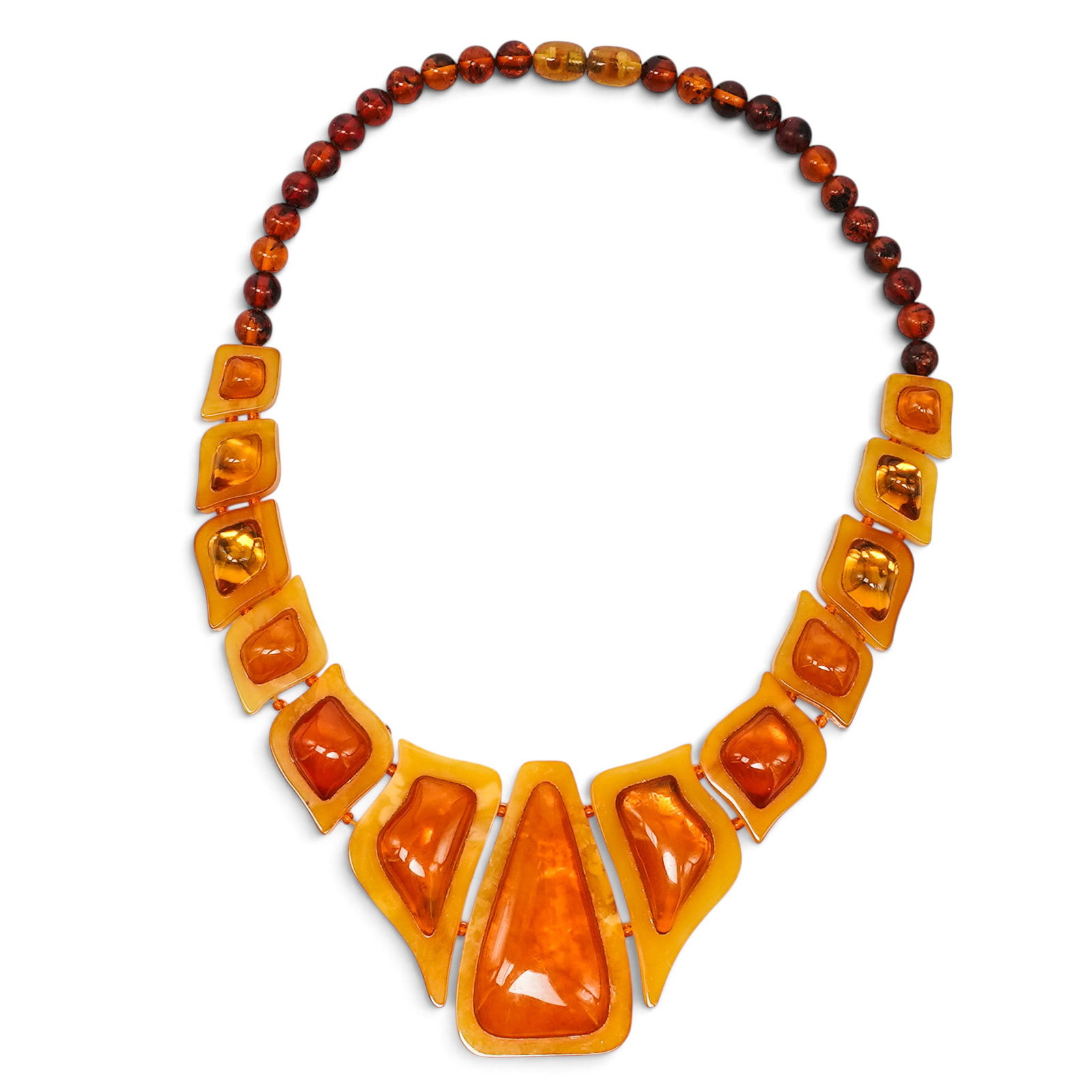 Large Art Deco Carved Amber Necklace: Large Art Deco Carved Amber Necklace Early 20th Century. Artist/Designer/Manufacturer: Unknown Marking(s): None. Materials: Amber Cataloger Note: Large graduated amber necklace featuring translucent h