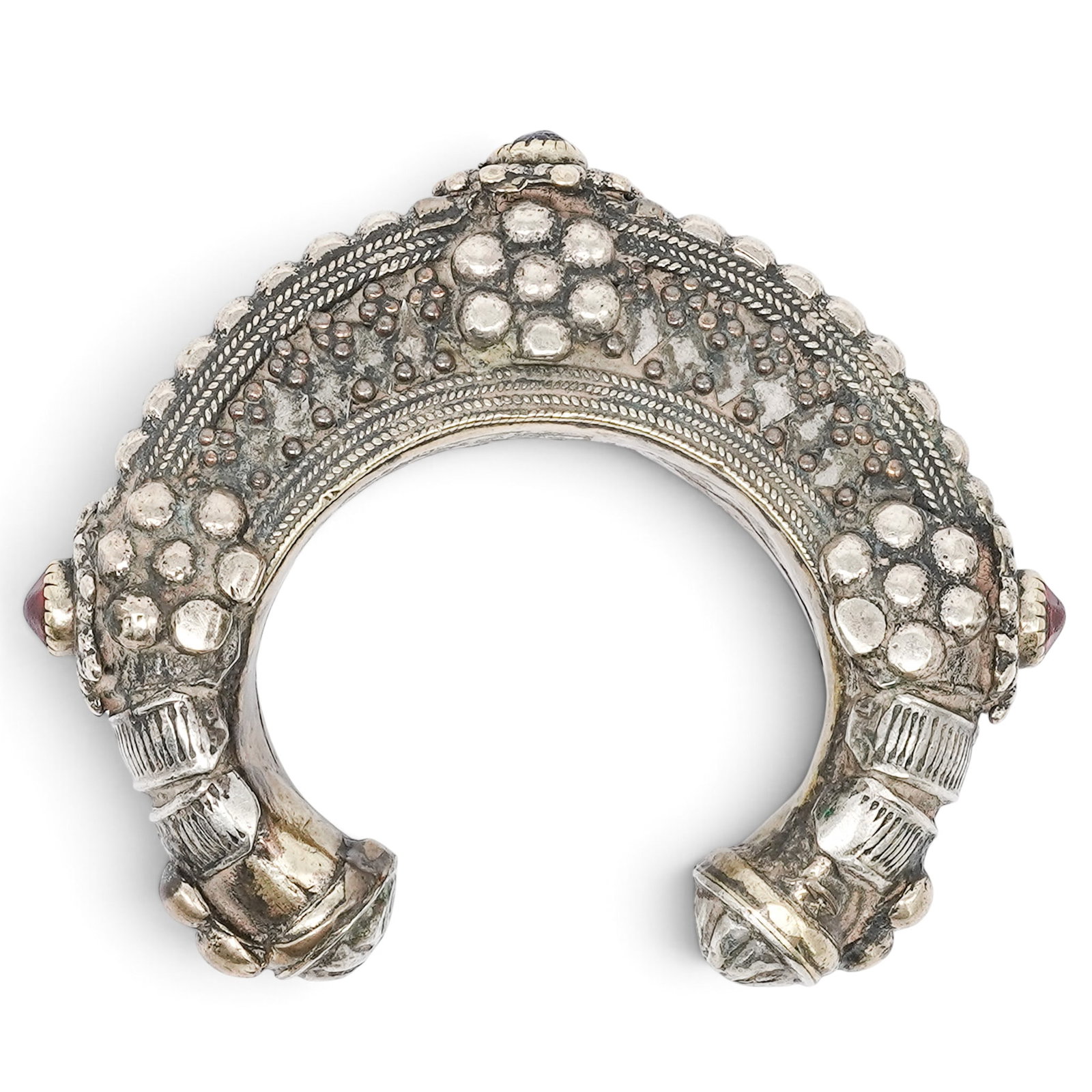 Antique Tribal Metal & Gemstone Inlay Cuff Bracelet: Antique Tribal Metal & Gemstone Inlay Cuff Bracelet Early 20th Cent., Central Asian Artist/Designer/Manufacturer: Unknown Marking(s): None. Materials: Silver, red and blue gemstones Cataloger Note: Br