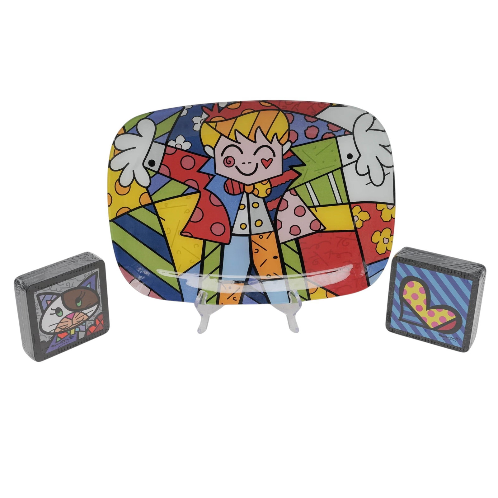 (3pc) Romero Britto (Brazilian, 1963-) Pop Art Coaster Sets & Tray: (3pc) Romero Britto (Brazilian, 1963-) Pop Art Coaster Sets & Tray 21st Century, USA Artist/Designer/Manufacturer: Romero Britto Marking(s): Signed “Romero Britto.” Materials: Crystal, cork, p
