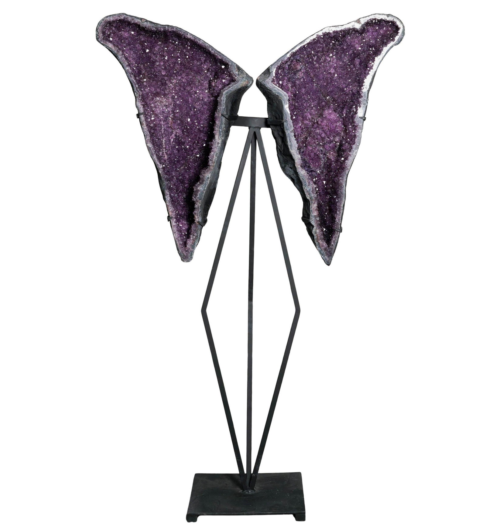 Large Amethyst Geode "Angel Wings" on Stand: Large Amethyst Geode "Angel Wings" on Stand 20th century Artist/Designer/Manufacturer: Brazil Marking(s); notes: None Materials: amethyst, metal Cataloger Note: Pair of amethyst geode wings featuring