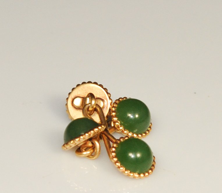 Vintage Pair of 14k and jade cufflinks. Mint: DESCRIPTION: Pair of 14k and jade cufflinks. Each cufflink with spinach jade half balls mounted in a 14k beaded bezel with infinite style links. 6.6 grams CIRCA: 1960's-1980's ORIGIN: Europe DIMENSION