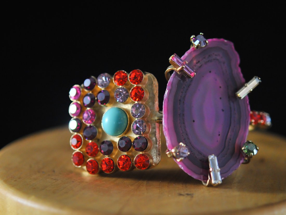 Daniel Swarovski Collectors Parure Set: DESCRIPTION: Daniel Swarovski extremely unique collectors parure set of cuff and earrings with every multicoloral swarovski, torqoise, and agate stone strongly pronged in, set in an antiqued copper fi