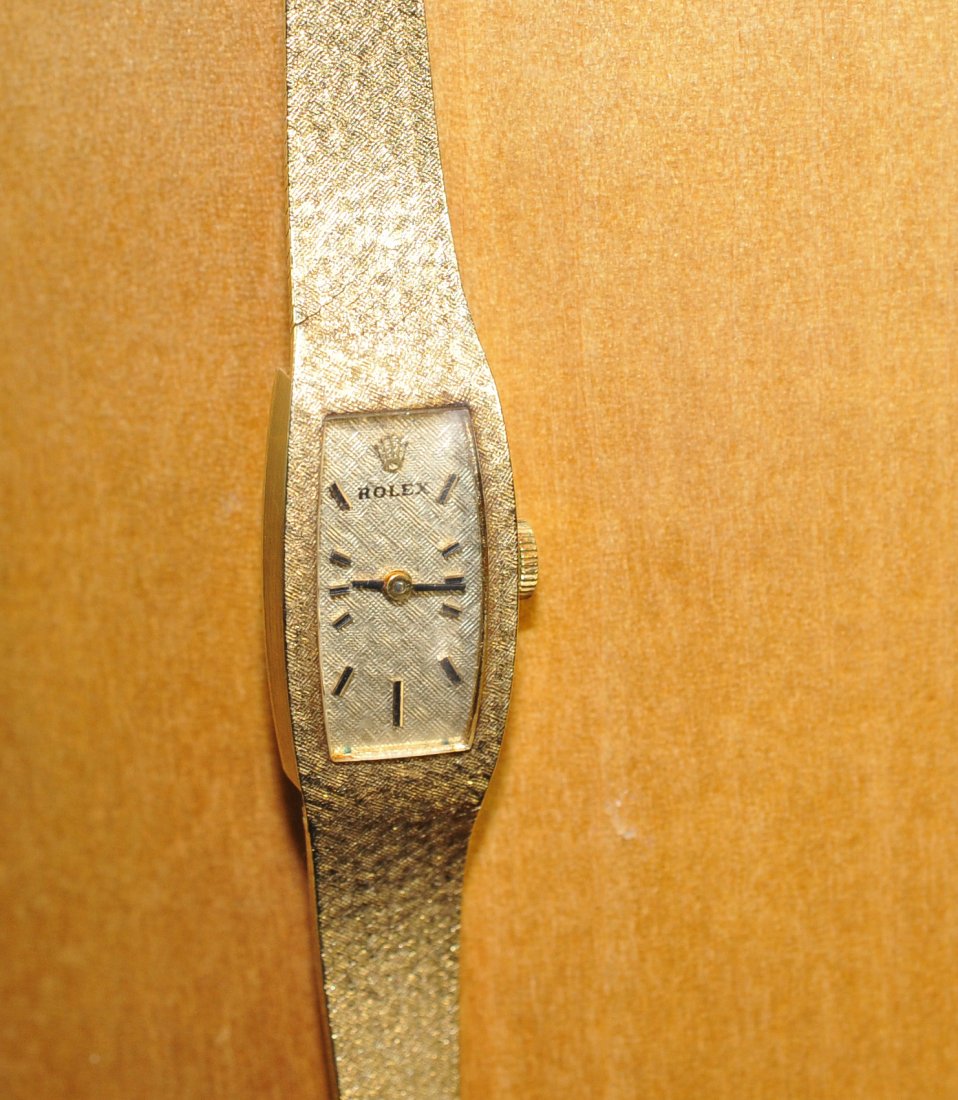 Antique Ladies 14k Yellow Gold Rolex: DESCRIPTION: Vintage Rolex Cellini ladies 14K yellow gold Watch. Champagne dial with mechanical wind up watch, black hours and minutes hand. Perfect working condition. CIRCA: 1930-1950s ORIGIN: Swiss 
