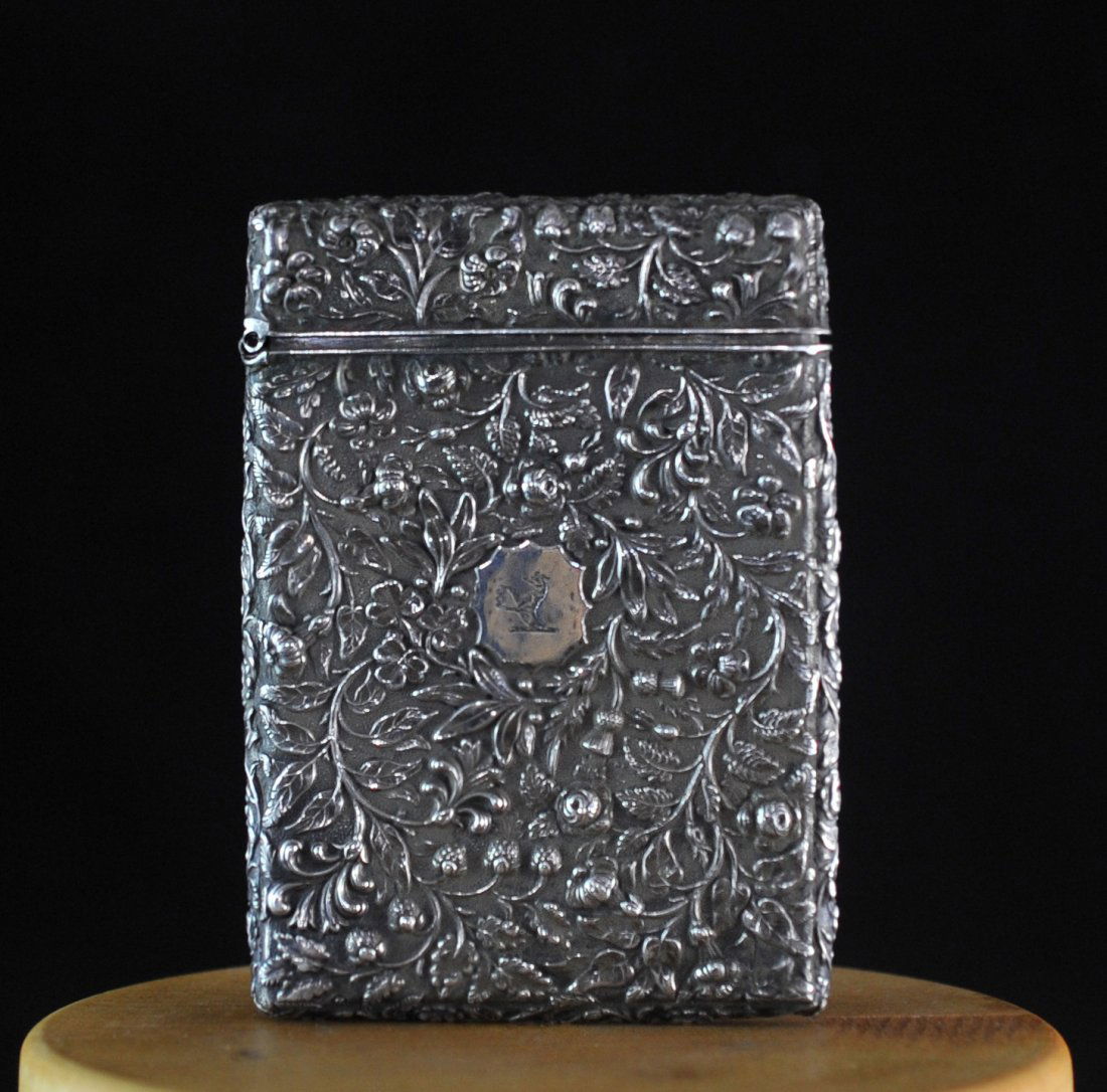 Antique Chinese Sterling Silver Card Case: DESCRIPTION: Antique floral designed card case made of sterling silver. Hallmarked on the interrior lid with Chinese characters. Weighs a total of 71 grams. CIRCA: 19th ct ORIGIN: China DIMENSIONS: H:
