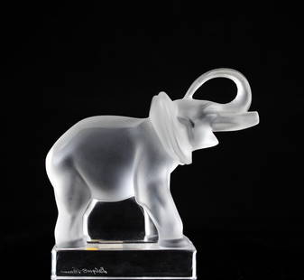 Lalique "Elephant" Paperweight: DESCRIPTION: Lalique footed frosted crystal "Elephant" paperweight sculpture, elephant is smiling with it's trunks up. Signed "Lalique France" on bottom of the base.CIRCA: 20th CenturyORIGIN: