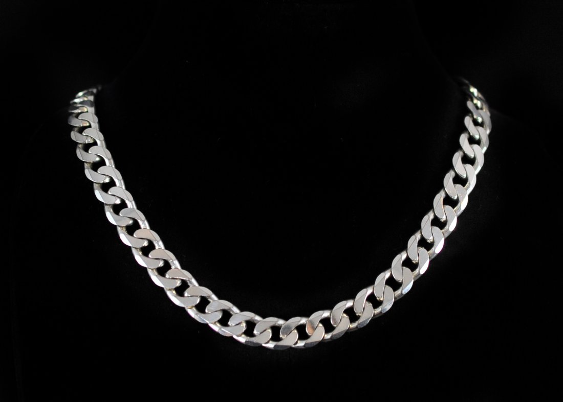 Sterling Silver Cuban Link Necklace: DESCRIPTION: High quality Italian made .925 sterling silver Cuban link (curb) choker necklace. Weighs a total of 87 grams. Hallmarked on the clasp. Never worn, like new. CIRCA: late 20th century ORIGI