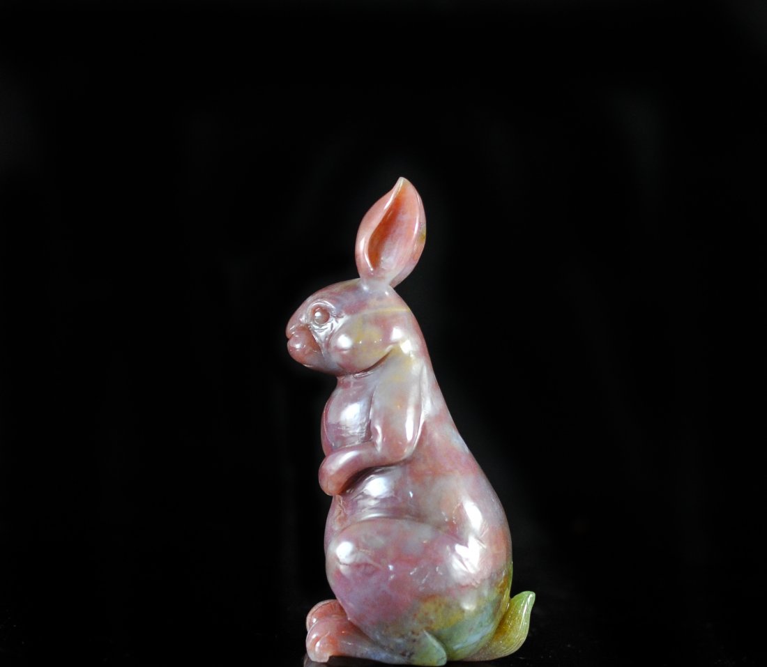 Chinese Multi-Colored Jade Rabbit: DESCRIPTION: Chinese jade rabbit or moon rabbit, beautifully carved multi-color jade, prominent color is a natural red tone with the bottom havingÂ some streaked green, it is standing upright looki