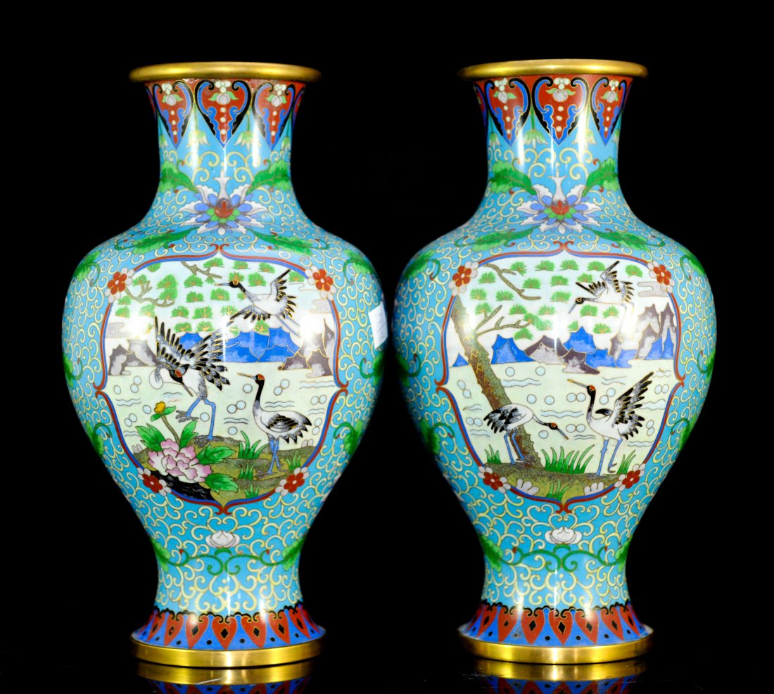 Pair of Large Vintage Chinese Cloisonne Vases: DESCRIPTION: Pair of large vintage Chinese cloisonne vases. Subtle turquoise ground color with off white ribbon decorations. Multi colored floral arrangements with a symmetrical foliate motif. Each va