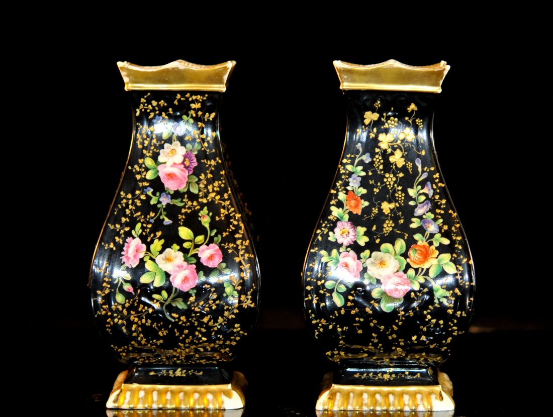 Pair of Vintage Porcelain Hand Painted Vases: DESCRIPTION: Pair of vintage porcelain hand painted vases. Four sided design with a teardrop body style. Black ground color with vibrant multi colored hand painted flowers and foliage. The body itself