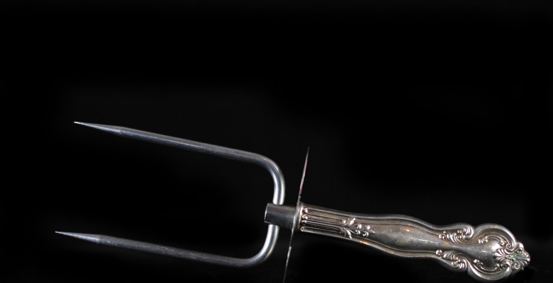 Sterling Silver Two Prong Roast Carving Holder: DESCRIPTION: Frank M. Whiting Sterling Silver Two Prong Roast Lifter Carving Holder. Sterling silver handle and the prongs are stainless. Hallmarked with Frank M Whiting makers mark. Piece is used for