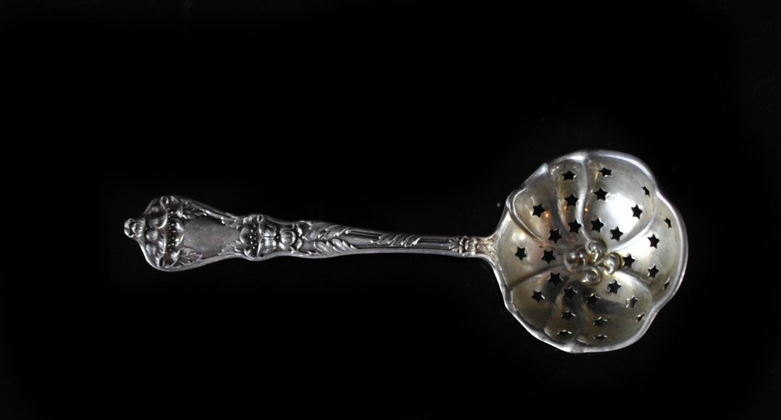 Antique Sterling Silver Tea Infuser Spoon: DESCRIPTION: Sterling silver tea infuser spoon with beautiful baroque floral pattern on front and back of handle. Features a deep infuser with five pointed star hole pattern. Hallmarked on back "Sterl