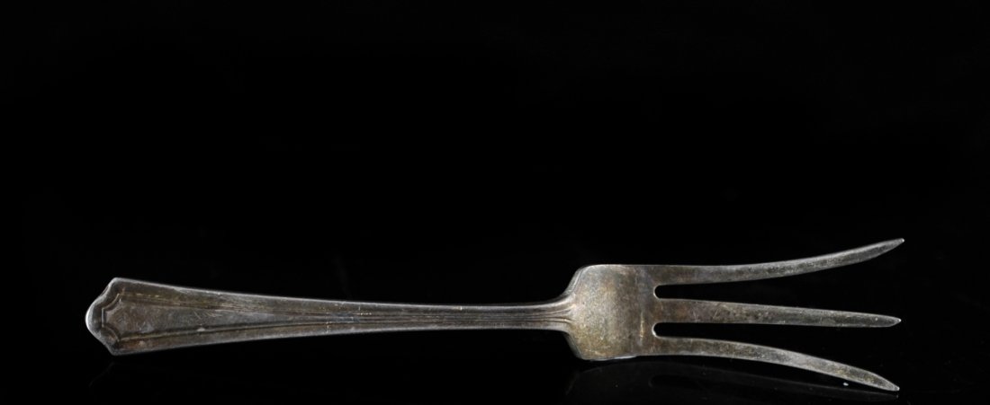 Sterling Silver Lemon Fork: DESCRIPTION: Sterling Silver lemon fork. Shows clear age and oxidation. Hallmarked and stamped with Sterling on the back. Weighing 14 grams of sterling silver. CIRCA: early 20th century ORIGIN: Unknow
